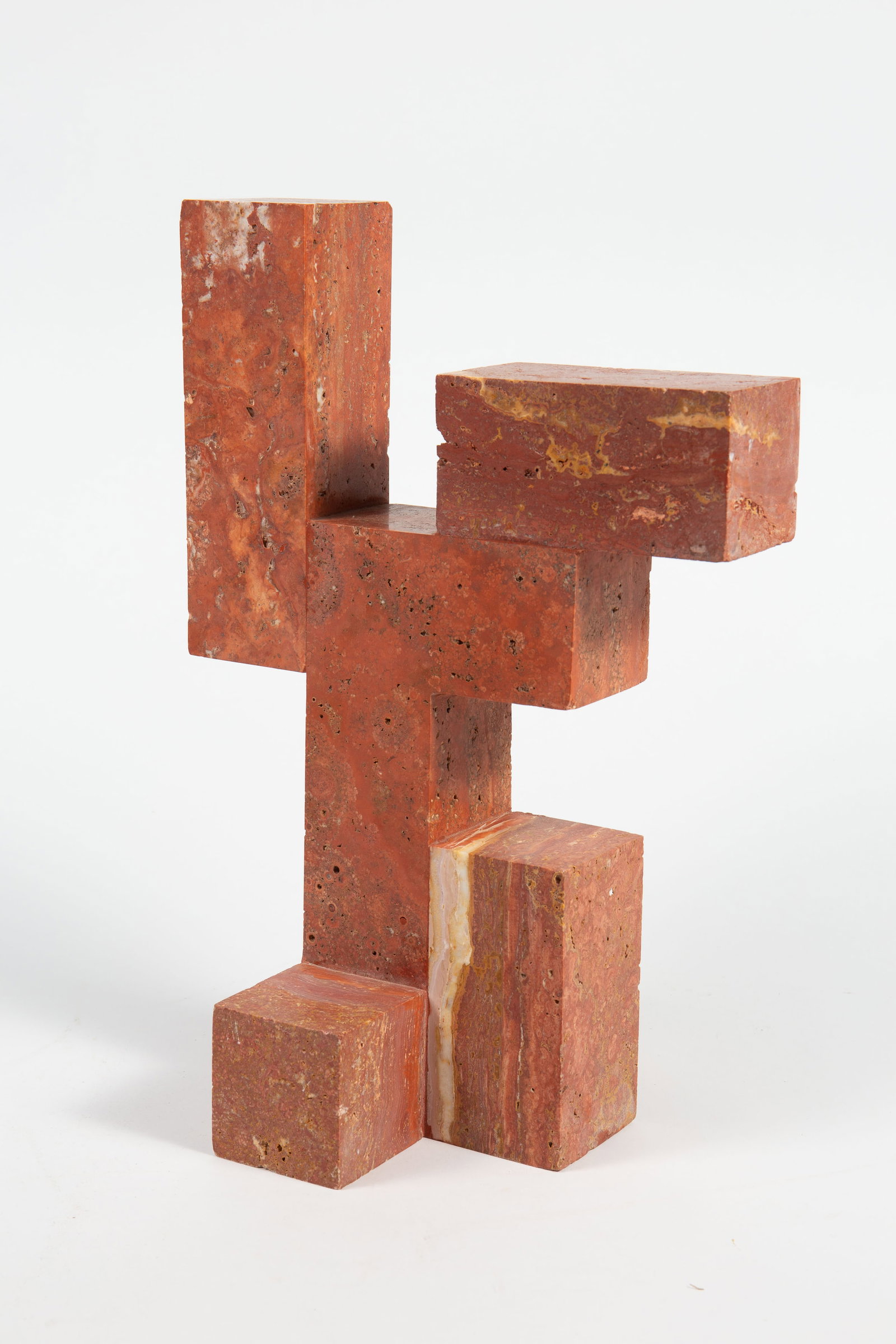Nicholas Obeid CB2 "Luis" Travertine Sculpture.: This abstract table sculpture has some nicks and pitting. Overall, it looks to be in nice cosmetic condition. The dimensions are 10" x 7 3/4" x 15". In-house shipping is available. Please see our