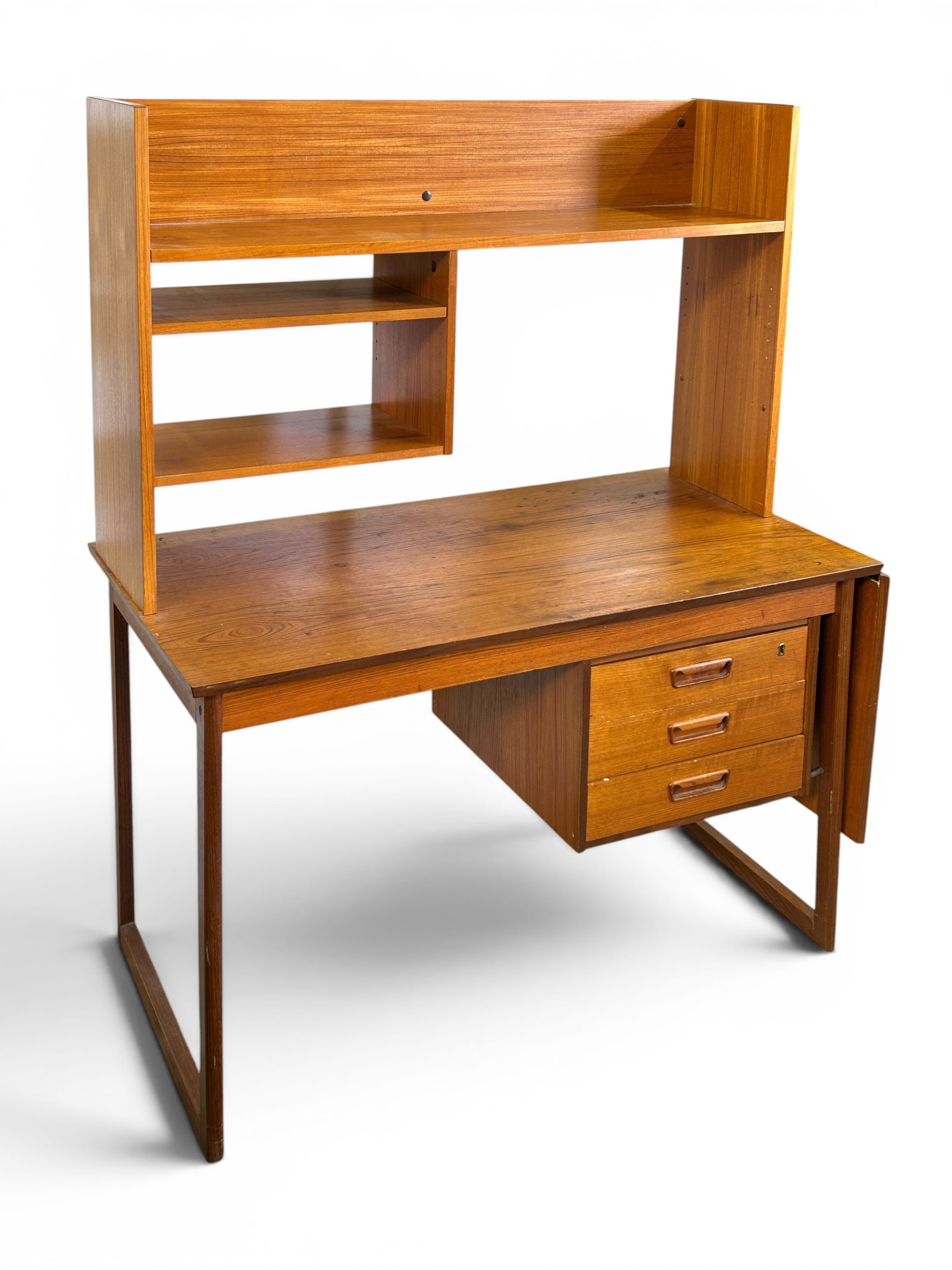 Danish Modern Teak Desk.: The desk has a dropleaf side and 3 drawers. It also has a removable shelf, bookcase, or hutch on top. The desk measures 29" tall, 47" wide, and 24 1/2" deep. The dropleaf measures 20" wide, and the