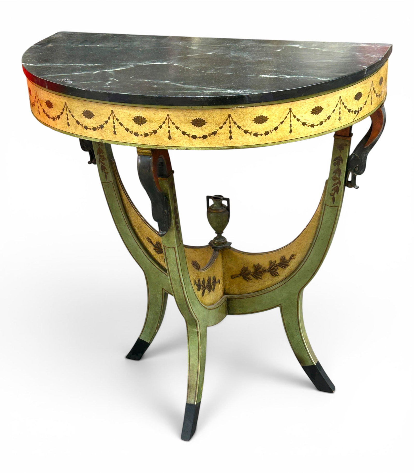 French Painted Demilune Table w/ Swan Carvings.: The antique table features handpainted gilded flower and leaf decorations, as well as low relief foliage decorations and three carved swan heads with spheres in their beaks where the legs meet the