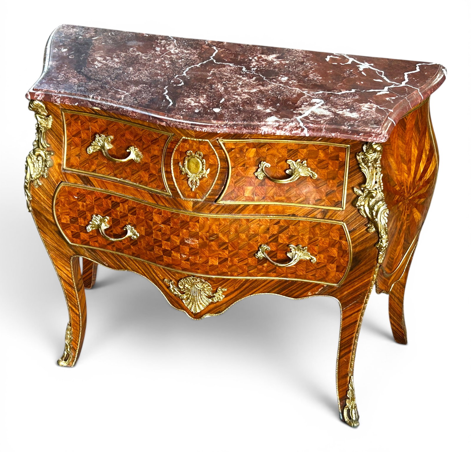 French Louis XV Style Marble Top Chest of Drawers.: The antique chest of drawers features inlaid wood designs of starbursts on the sides, and checkered grids on the 3 front drawers. It has a burgundy marble top, and intricate gilded brass hardware on