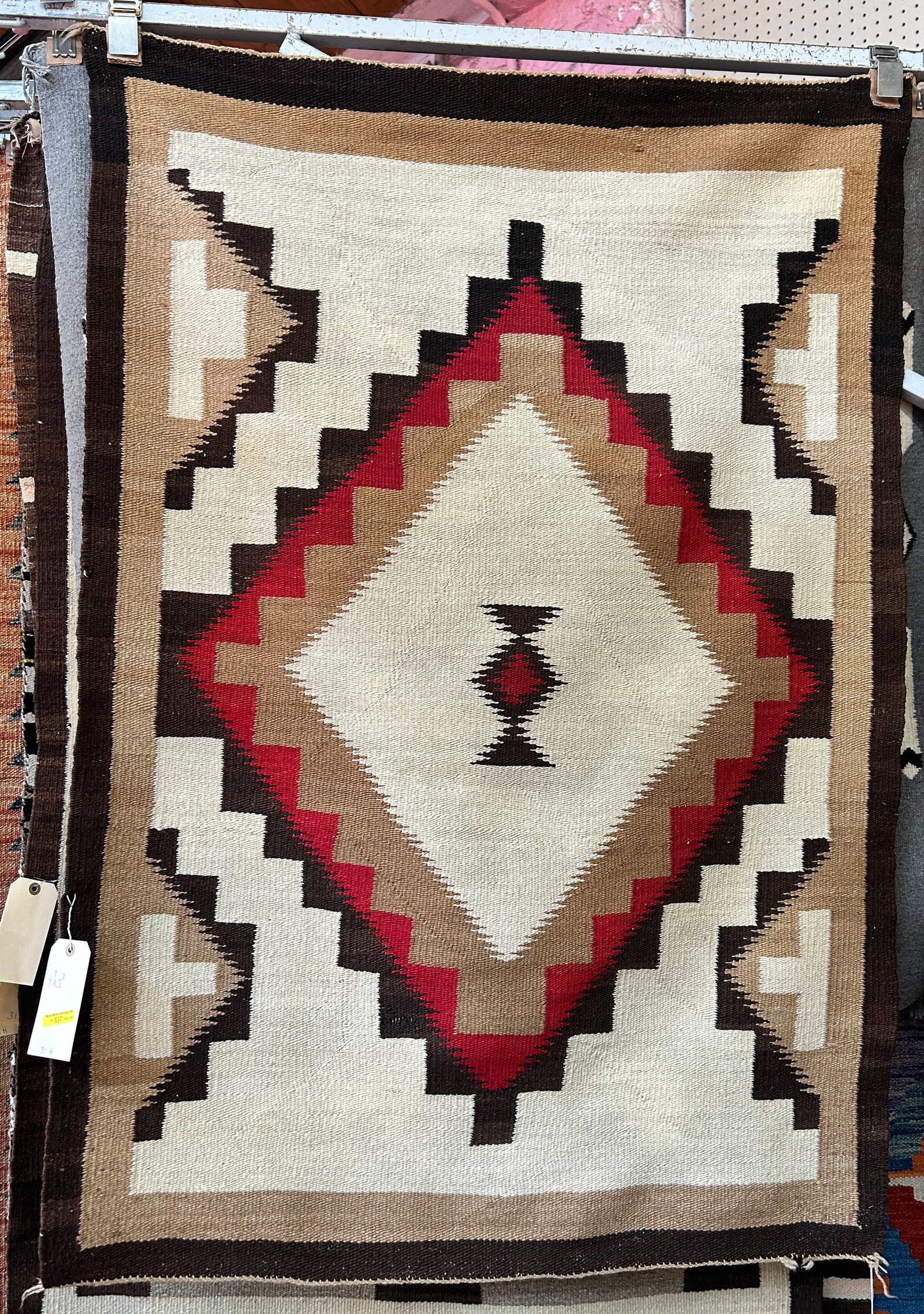 3' 3" x 4' 9" Eye Dazzler Navajo Rug.: This looks to be an older rug. It has a bit of wear, but is in good overall condition (please see photos). In-House Shipping is available for this rug. Please see our website for our in-house shipping