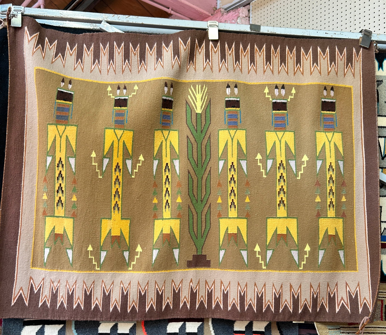 3' 3" x 4' 2" Earth Tone Navajo Yei Rug.: The rug looks to be on the newer side. It is in good condition. In-House Shipping is available for this rug. Please see our website for our in-house shipping procedures.