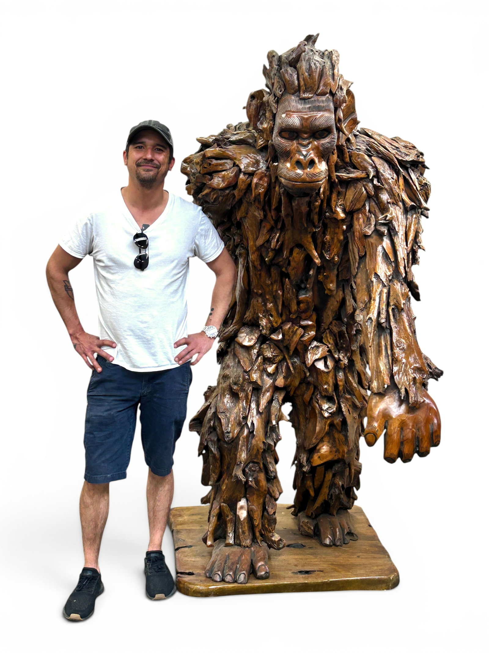 Massive Teakwood Bigfoot Sasquatch Sculpture.: The sculpture depicts a walking Bigfoot or Sasquatch. It is composed of reclaimed and carved teakwood. It measures 80" tall, 34" wide, and 73" deep. There are some scratches, scuffs, and stains on
