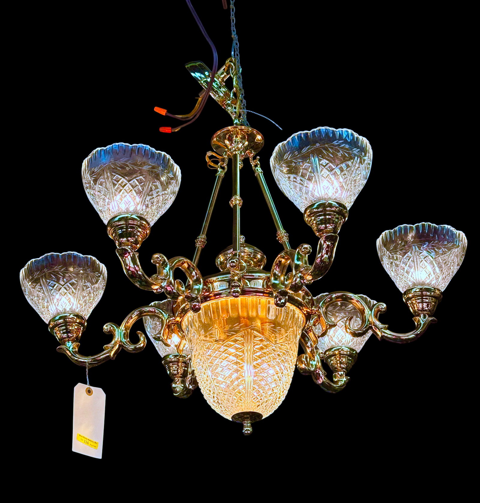 Antique Style 6-Arm Brass & Glass Chandelier.: The 8-light chandelier has a polished brass body with scrolls and molded crystal shades with small etched or cut flowers. The piece measures 26" long and 20 1/2" in diameter. There are some scratches 