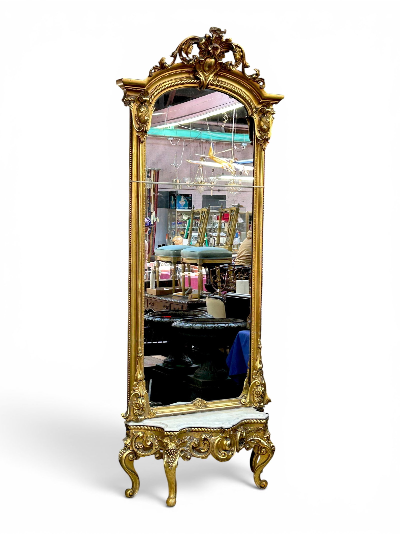Victorian Giltwood Pier Mirror & Marble Top Base.: The mirror has a carved shell and floral crest, beaded design, columns, and medallion carvings. The mirror sits on a bevelled marble top base that has giltwood carvings and curved legs. The top of the