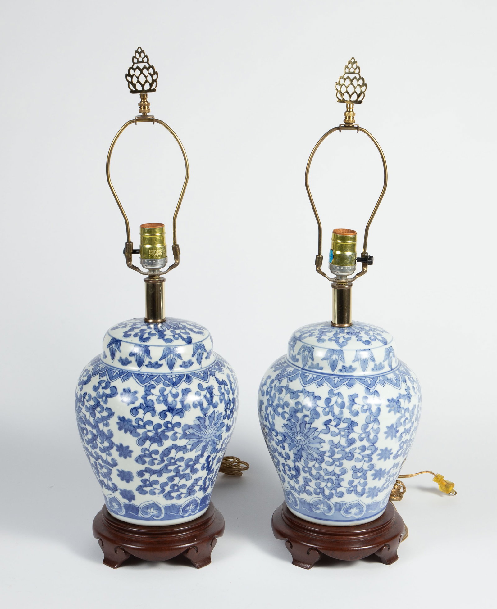 Asian Style Blue & White Ginger Jar Lamps.: One of them has a tilted finial. Overall, they look to be in good cosmetic condition. Each one measures approximately 8 1/8" x 8 1/8" x 26". In-house shipping is available. Please see our website