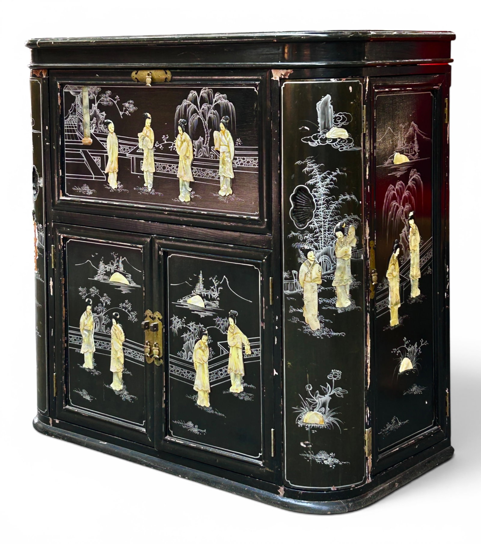 Chinoiserie Black Lacquer Liquor Cabinet.: The vintage cabinet features hardstone and mother of pearl relief figures and scenery. It has a flip top, mirrored interior with beverage and glass holders, and a drop front. It has 4 side opening doo