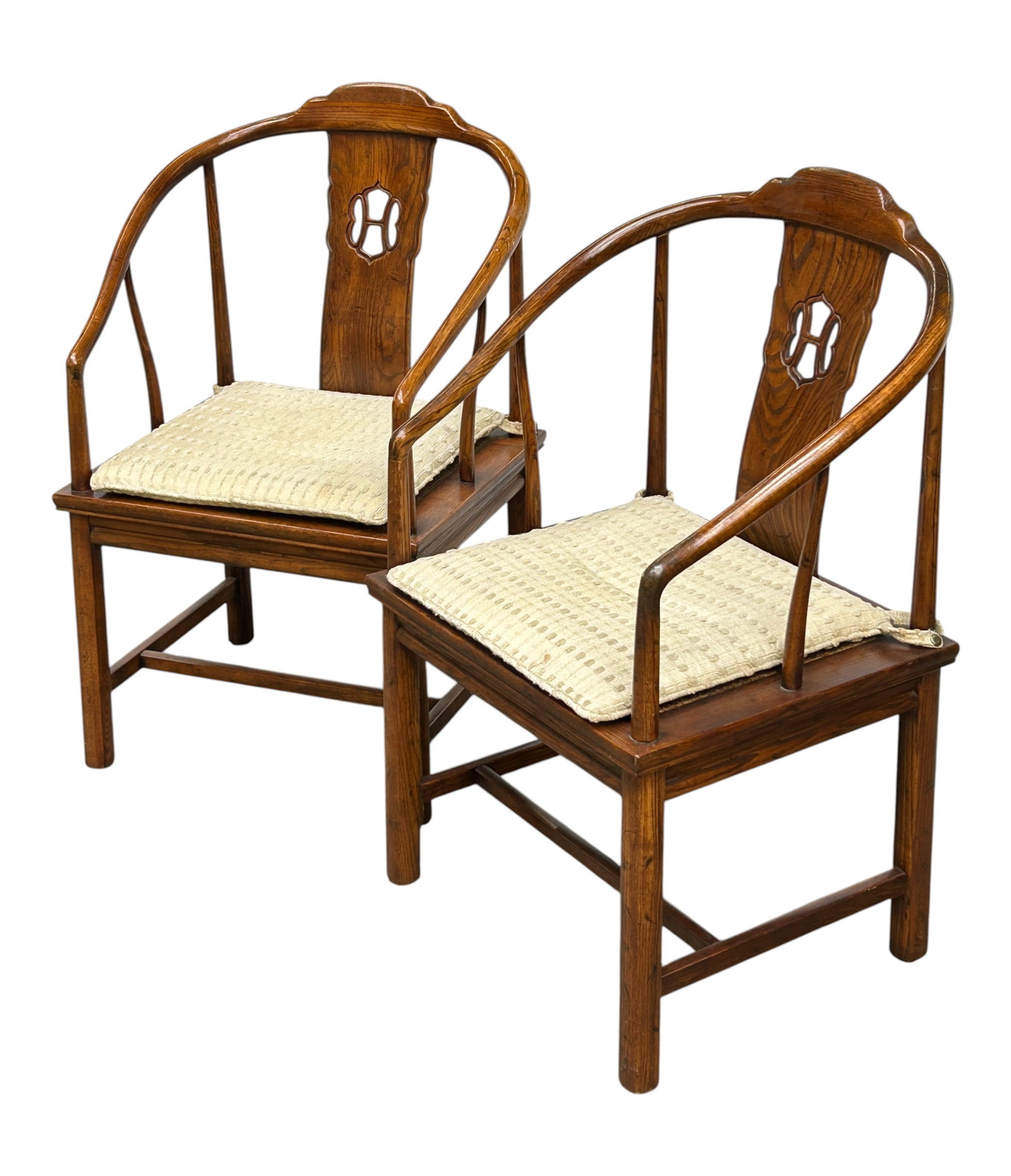 Pair of Henredon Chinese Style Armchairs.: The pair of chairs have curved backs and carved crests. They have cane seats, cushions, and stretcher supports. They measure 36 1/2" tall, 24 1/2" wide, and 22" deep. There are some scratches and