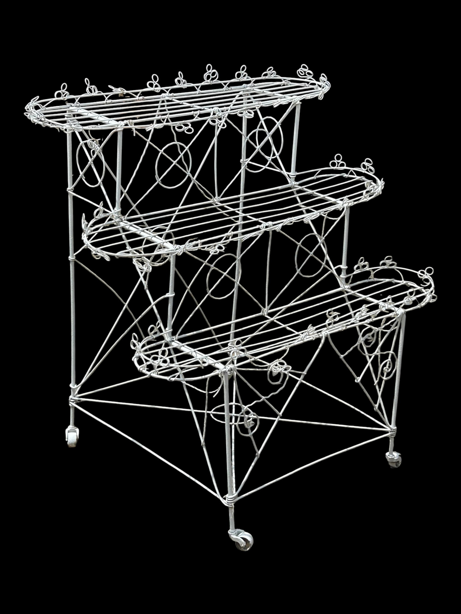 Victorian ? White Wire 3-Tier Plant Stand.: The plant stand is on 4 casters. It measures 39" tall, 36" wide, and 25 1/2" deep. There are some scratches, stains, paint loss, and bent wires on the piece. Otherwise, it is in overall good condition
