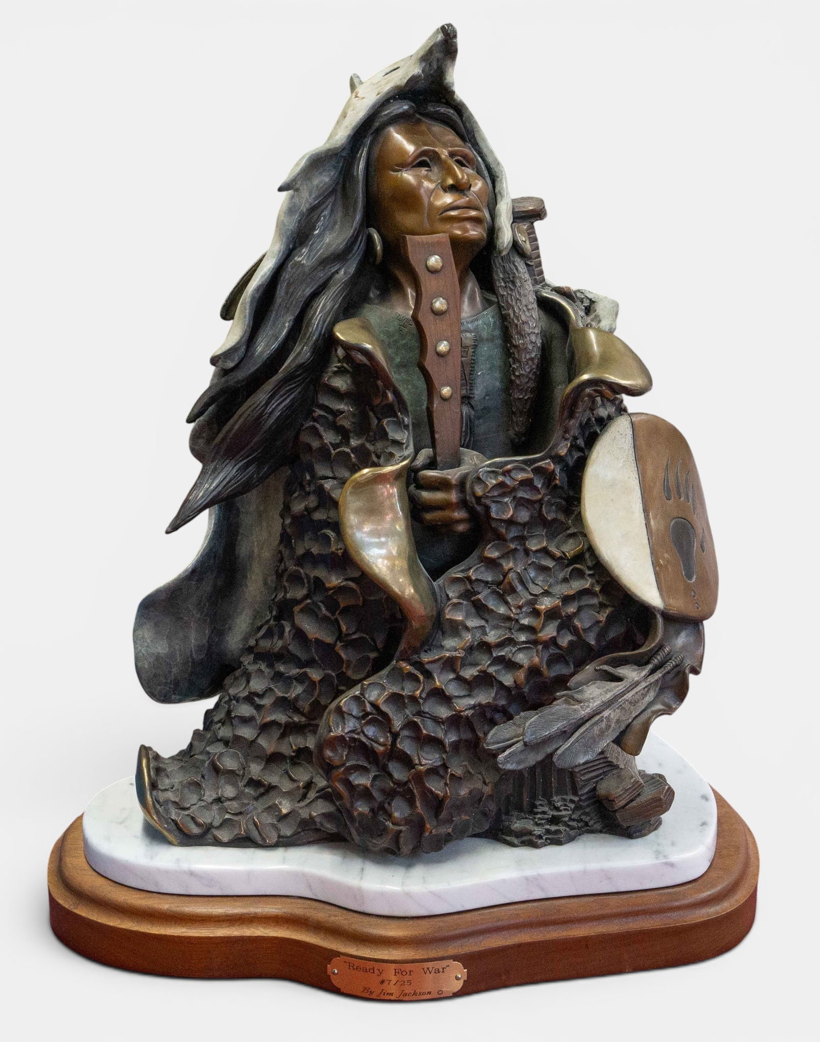 "Ready for War" Jim Jackson Bronze Bust.: This American Indian warrior bronze is on an attached marble and wood base, and is signed and numbered (#6/25). Overall, it looks to be in nice condition, with some minor stains on the wolf hide. The