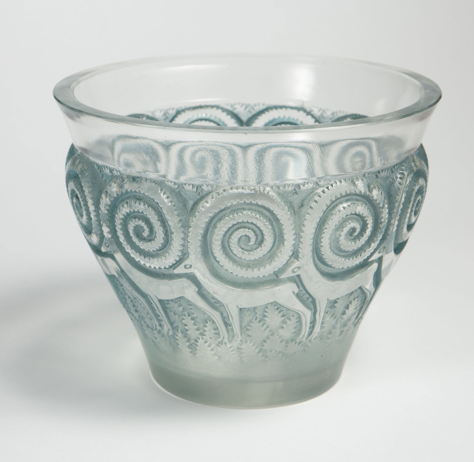 R. Lalique "Rennes" Clear and Blue Frosted Vase.: This vase has a motif of reindeer or antelope with large curled antlers. Overall, it looks to be in good condition, with some scratches and a few small fleabites along the rim. The vase measures 6