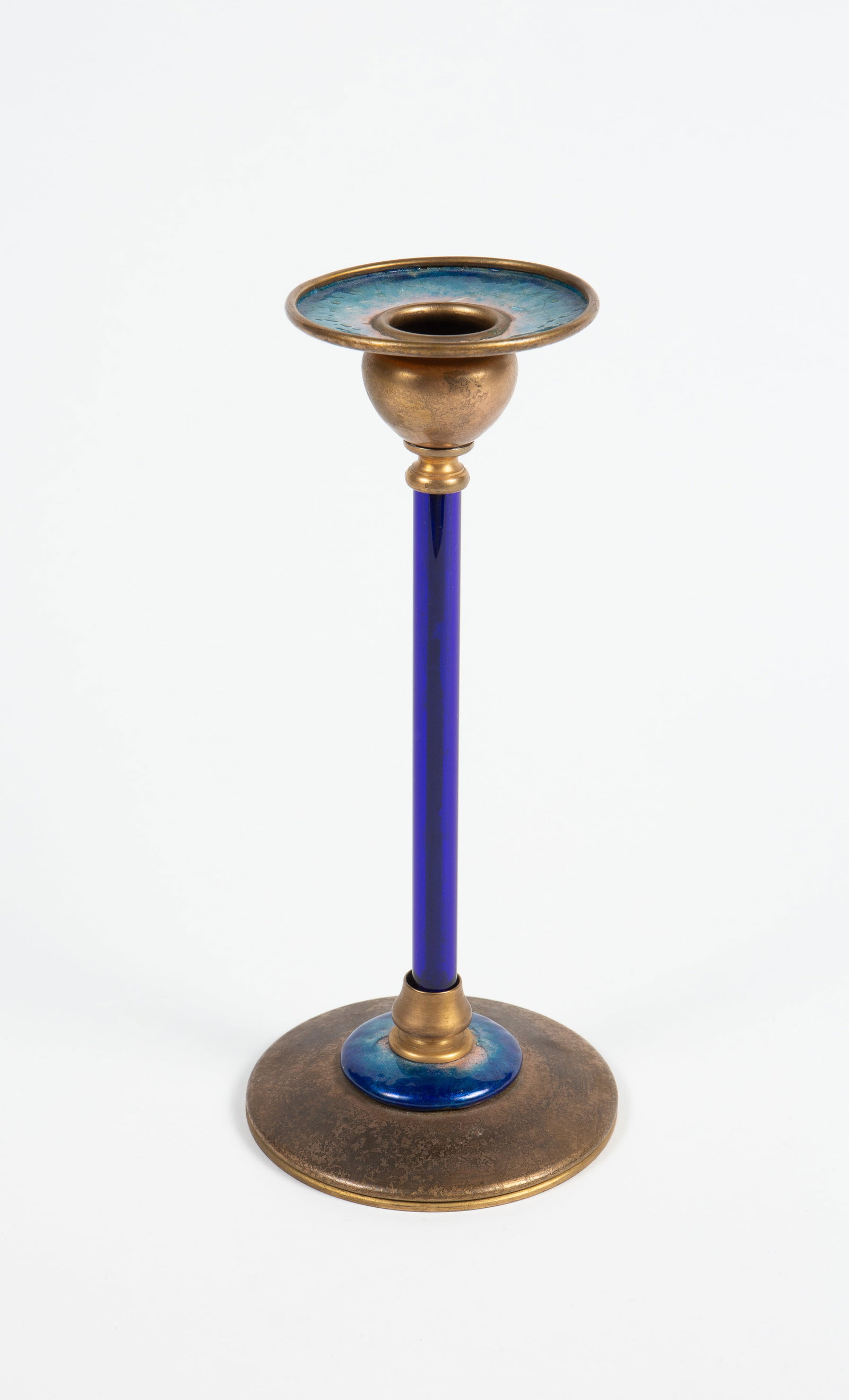 Louis C. Tiffany Furnaces 9" Candlestick.: This blue and gold colored candlestick is stamped, "Louis C. Tiffany Furnaces, Inc. 40" underneath, along with a Tiffany mark that dates it from the early 20th century. The blue stem may have been