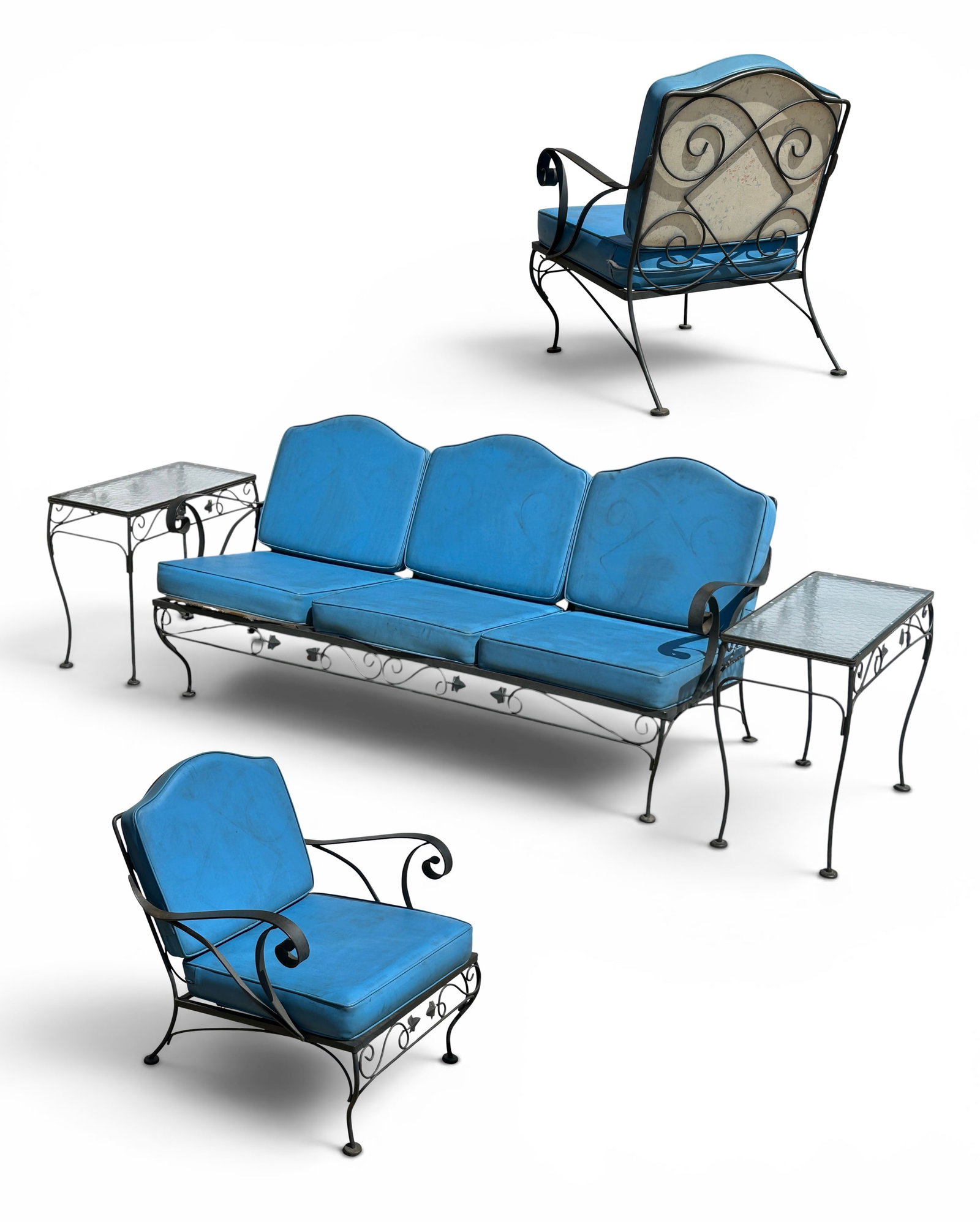 Wrought Iron Patio Set w/ Blue Vinyl Upholstery.: The vintage 5 piece patio set has scrolled arms, scroll and leaf decorations, and curved legs. The 3 seat sofa and the 2 armchairs have removable seat and back cushions, which have removable