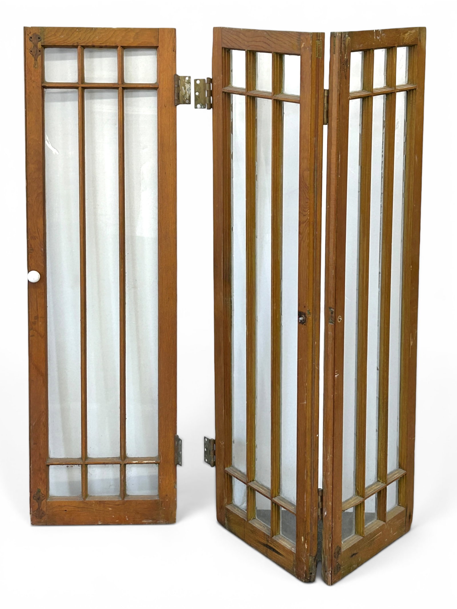 Set of Three Oak Cabinet Doors or Windows.: Each Prairie style door has nine glass panes. Two of the doors are attached and the other is not. One has a white porcelain knob. They are in good condition, with some wear. Each door measures 16"