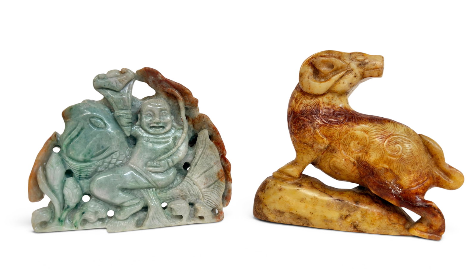 Lot of 2 Jade Chinese Carvings.: One is of a man riding a fish, and the other is of a ram on a hill. The man and fish figure has a little wear, otherwise it is in good overall condition. The ram looks to be in good overall condition.