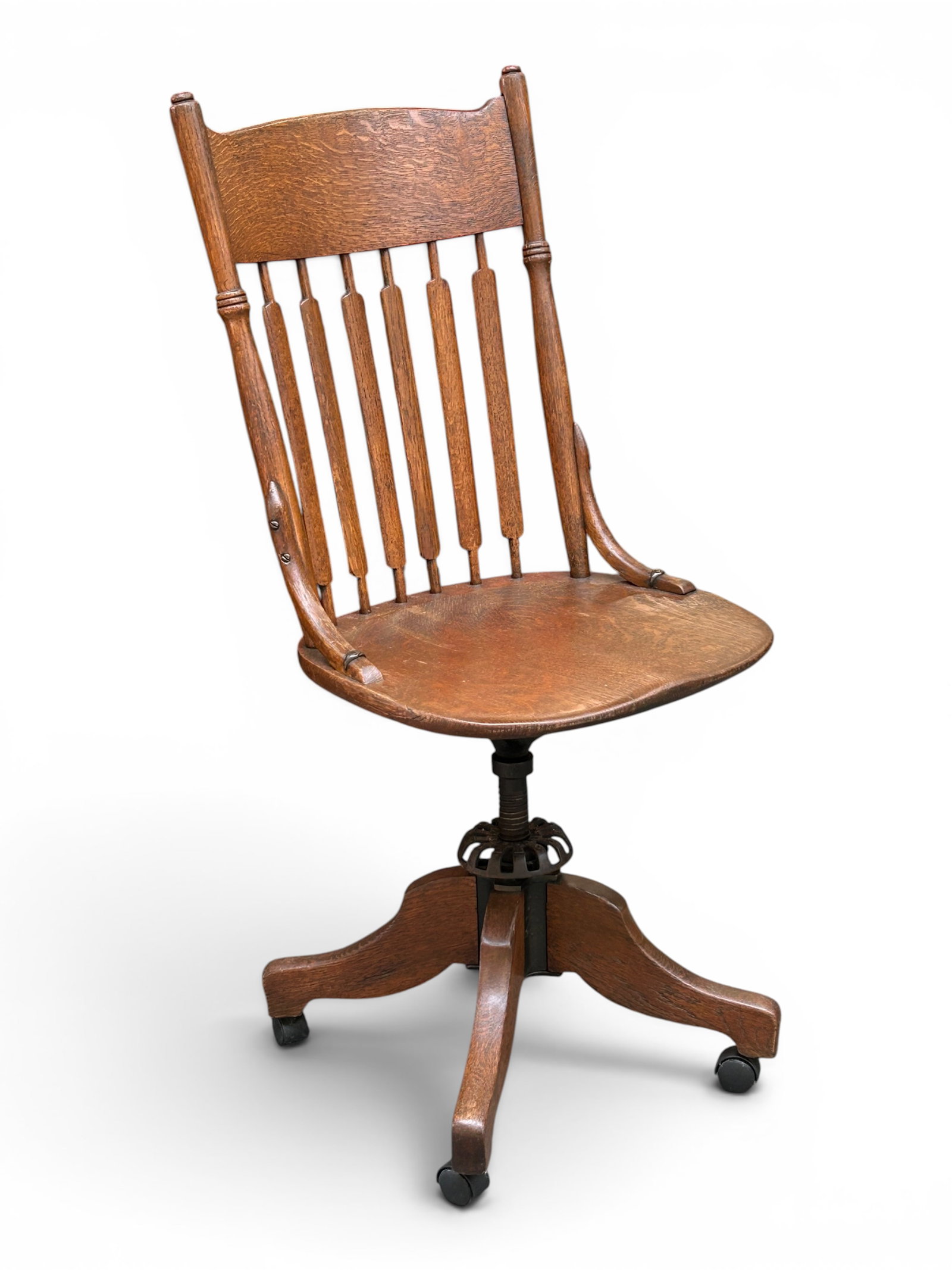 Antique Oak Swivel Desk Chair, F. Herhold & Sons.: The chair is branded F. Herhold & Sons on the iron swivel mechanism between the legs and the chair seat. The legs can be divided from the chair for transport. The piece measures 42 1/2" tall, 18 1/2"