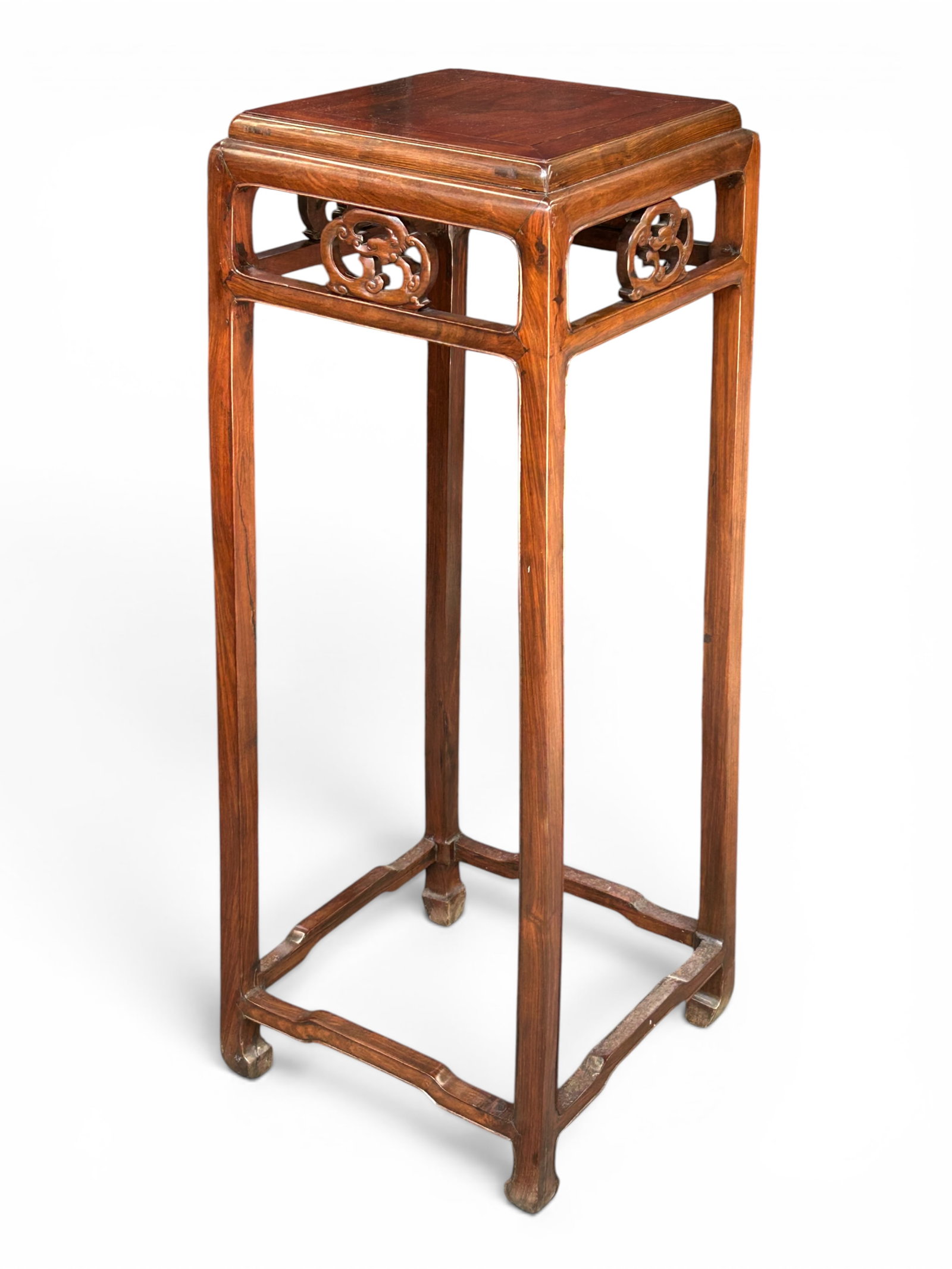 Chinese Hardwood Carved Stand.: The 3 1/2 foot stand has pierced curved carvings on each side near the square top. The bottom of the stand has 4 carved posts connecting the 4 legs, which curve inward at the feet. The piece has
