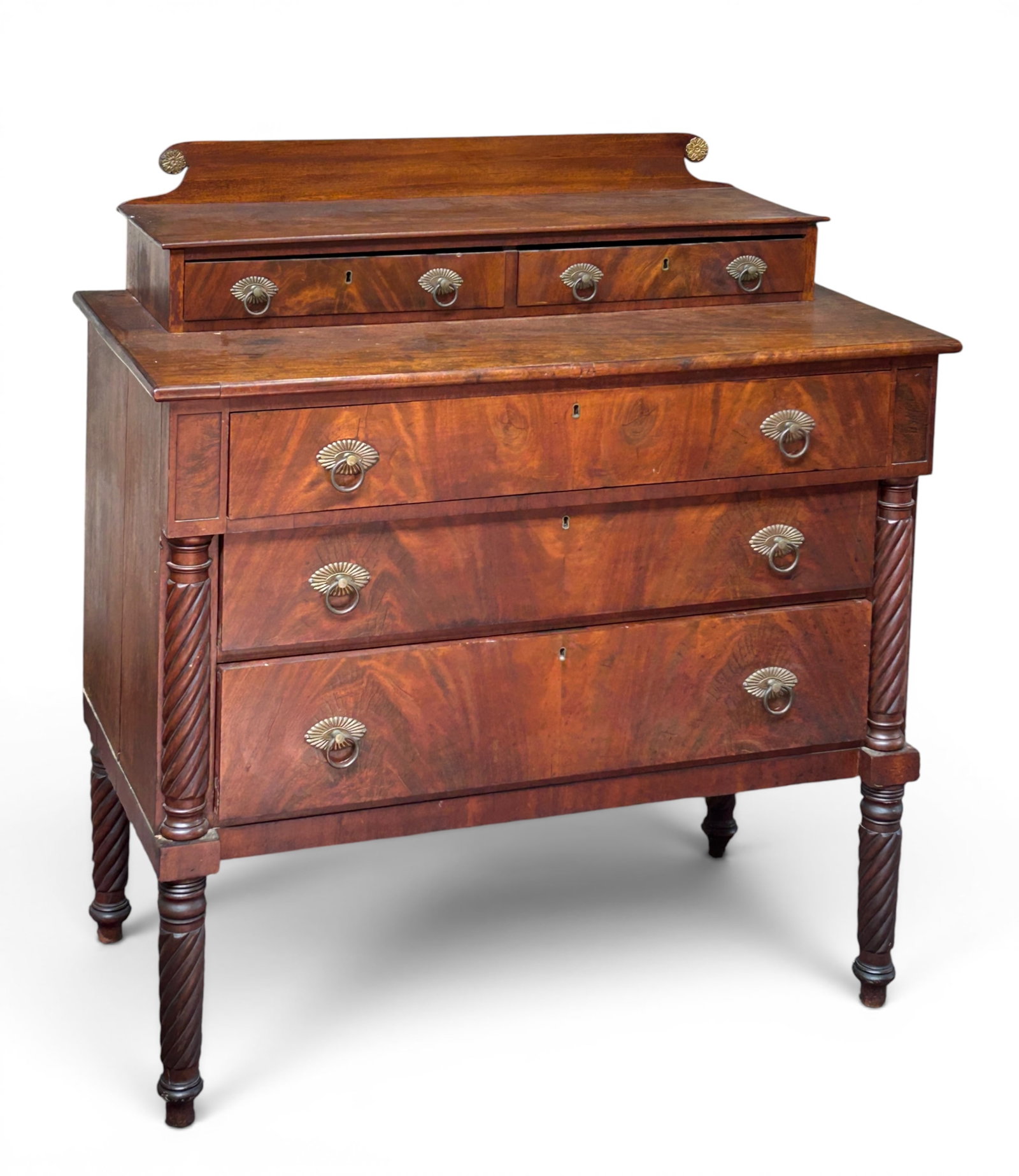 American Empire Step Back Drawer Chest.: The drawer chest or dresser has 3 wide drawers on the lower section, and two small drawers on the top section, which also has a small backsplash. The piece has gilded hardware, rope twist column