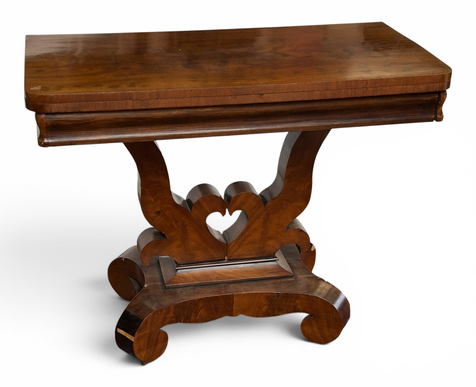 Empire Carved Flip Top Table w/ Pedestal Base.: The table has a 4 leg pedestal base on casters, and a wide carved apron. The top flips open to create a square top which rotates to be placed at the center of the base. The piece measures 30" tall,