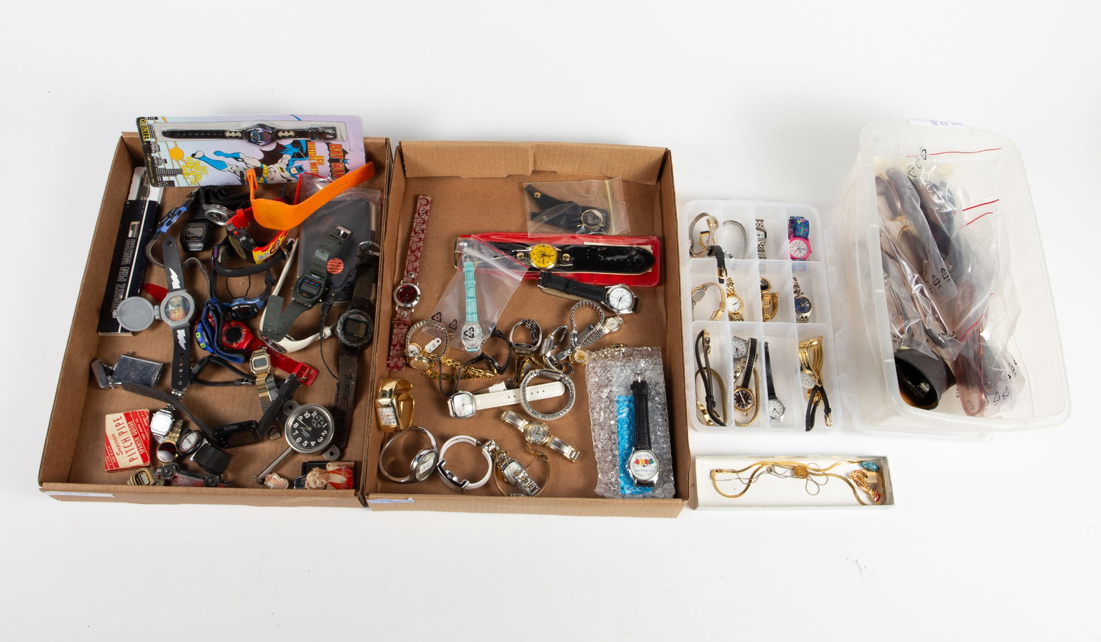 Lot of Watches, Sunglasses, & More.: The lot contains over 60 wristwatches, 9 pair of sunglasses, 7 pieces of costume jewelry, a vintage lighter, an Elgin dashboard clock, a Radio Shack 2-Person Championship Golf game, and more. The watc