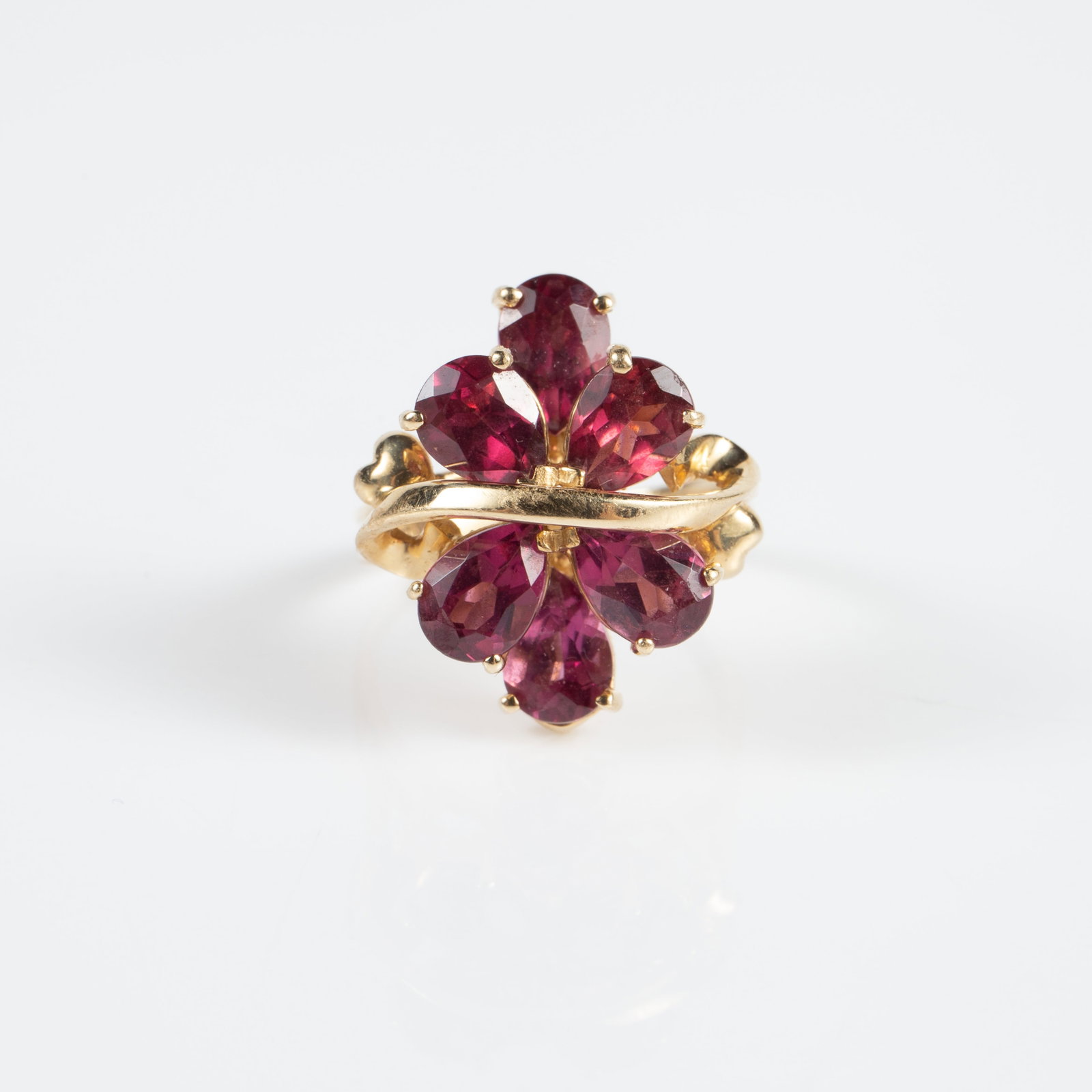10K Yellow Gold & Pink Stone Ring, EMA.: The ring is marked 10K EMA inside the band. It features 6 pear cut reddish-pink stones, possibly rhodolite garnet. The stones measure roughly 6mm x 5mm. The ring is a size 7, and measures up to 20mm f