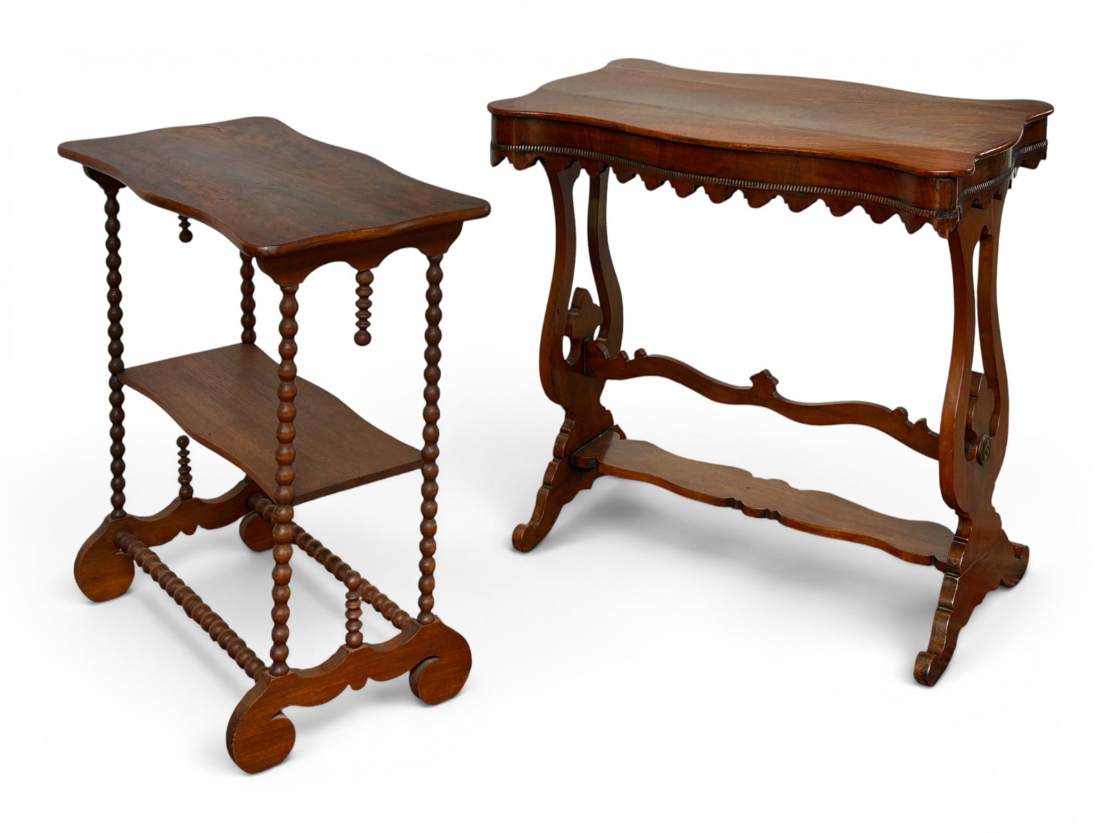 2 Antique Side Tables - Am. Victorian & English.: The lot contains 2 carved side or occasional tables. There is a 2-tier American Victorian piece with turned wood posts and finials, and an English walnut piece with a carved apron, legs, and stretcher