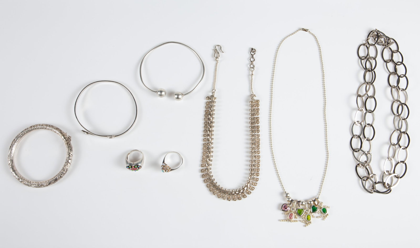 8 Pcs. Sterling Silver Jewelry inc. Long Necklace.: The lot contains 3 necklaces, 3 bracelets, and 2 rings. The long necklace is branded K. Amato, and the bracelet with the letters MS or SW is by Leonore Doskow. The necklace with small flower shapes is