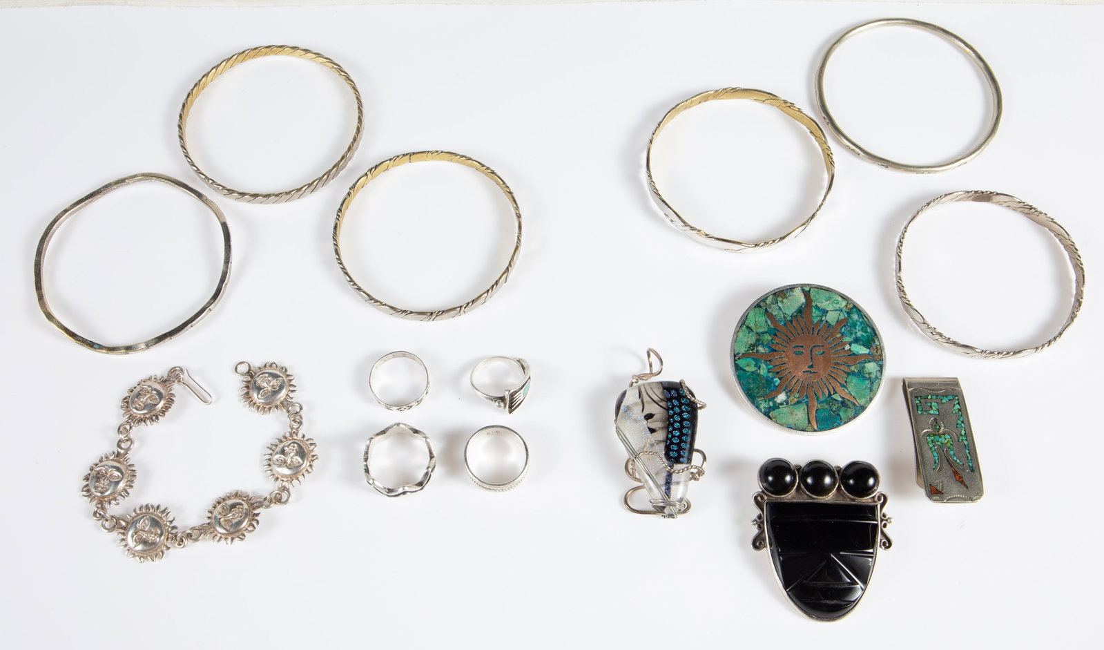 Lot of Mostly Sterling Jewelry - Mexico, Antonio.: The lot contains 15 pieces of jewelry, 11 of them being sterling silver. The non-sterling items are 3 bangles and the money clip with turquoise and coral mosaic. Some of the sterling pieces are: a bro