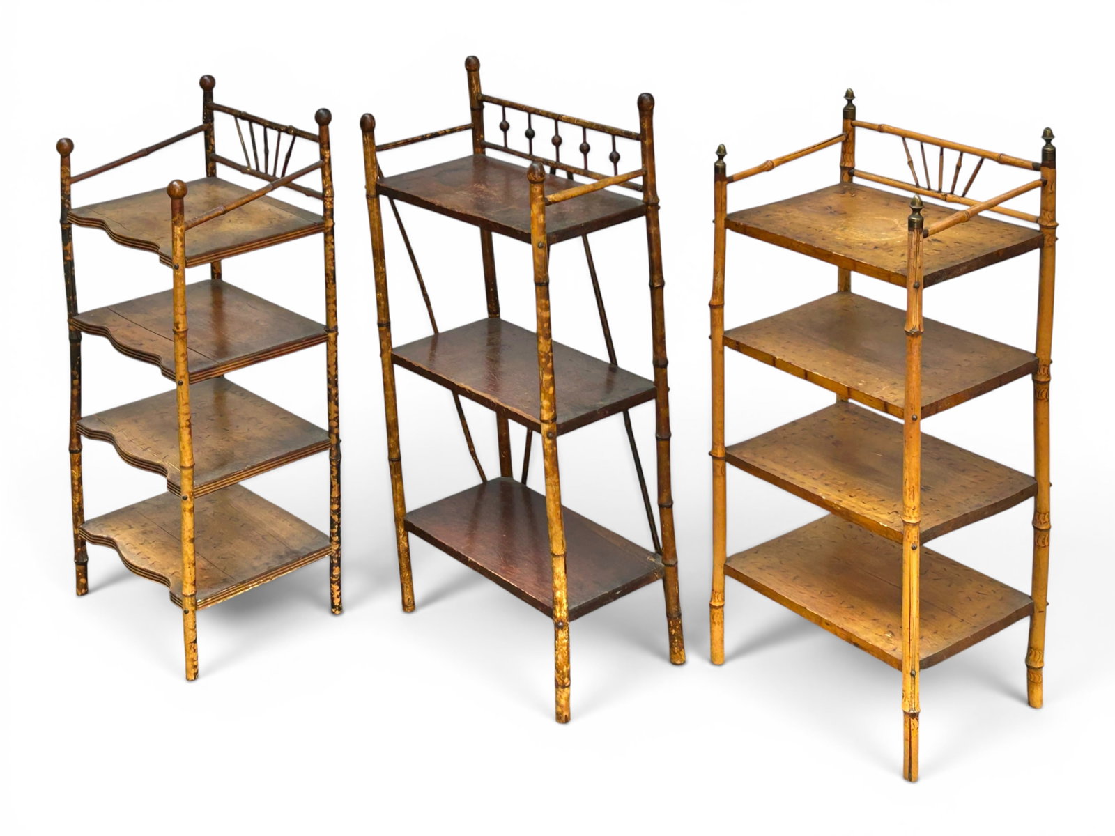 Lot of 3 Small Antique Bamboo Open Shelves.: The shelves all have bamboo legs and 3-4 wooden shelves. One piece has stick and ball decorations on the top, and another has brass finials and burned decorations on the shelves. The largest piece