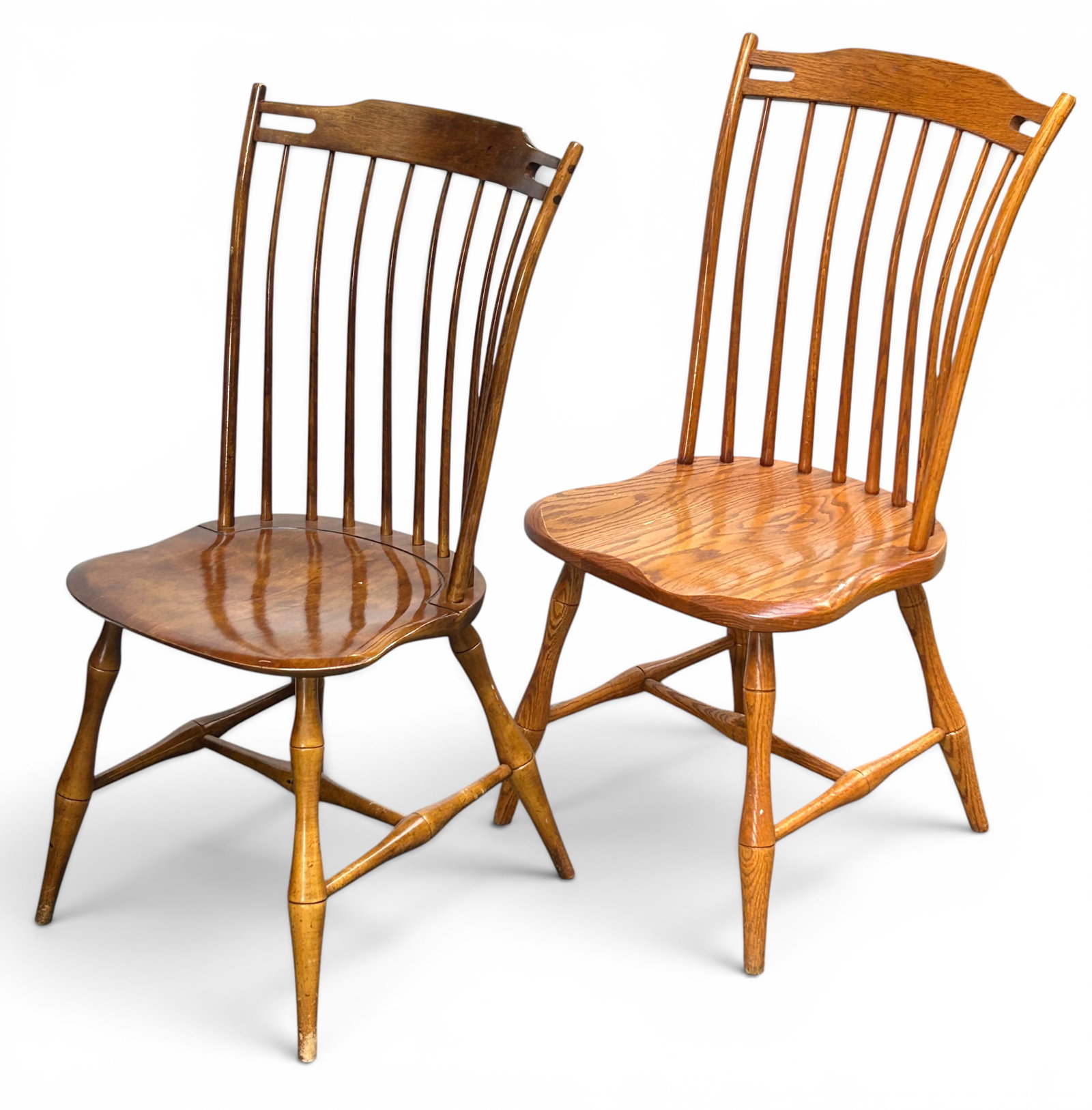 Lot of 2 Windsor Chairs - Antique & Seely Repro.: The lot contains 2 very similar windsor chairs. The slightly smaller one with a carved detail on the seat near the spindles appears to be antique, and is stamped H8? on the underside. The other