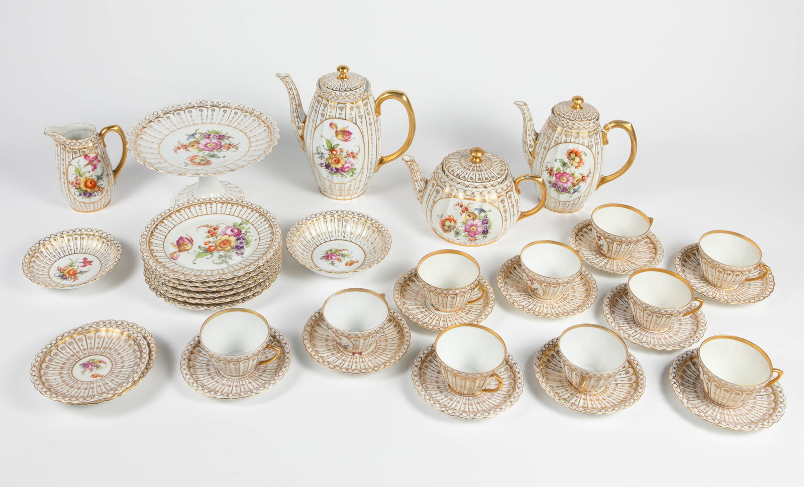 Ludwigsburg Tea & Coffee Set.: This set has gilded designs and floral bouquets, and looks to be in overall nice condition (a few pieces have small cracks). Included are the following pieces: a coffee pot w/ lid, a teapot w/ lid, a