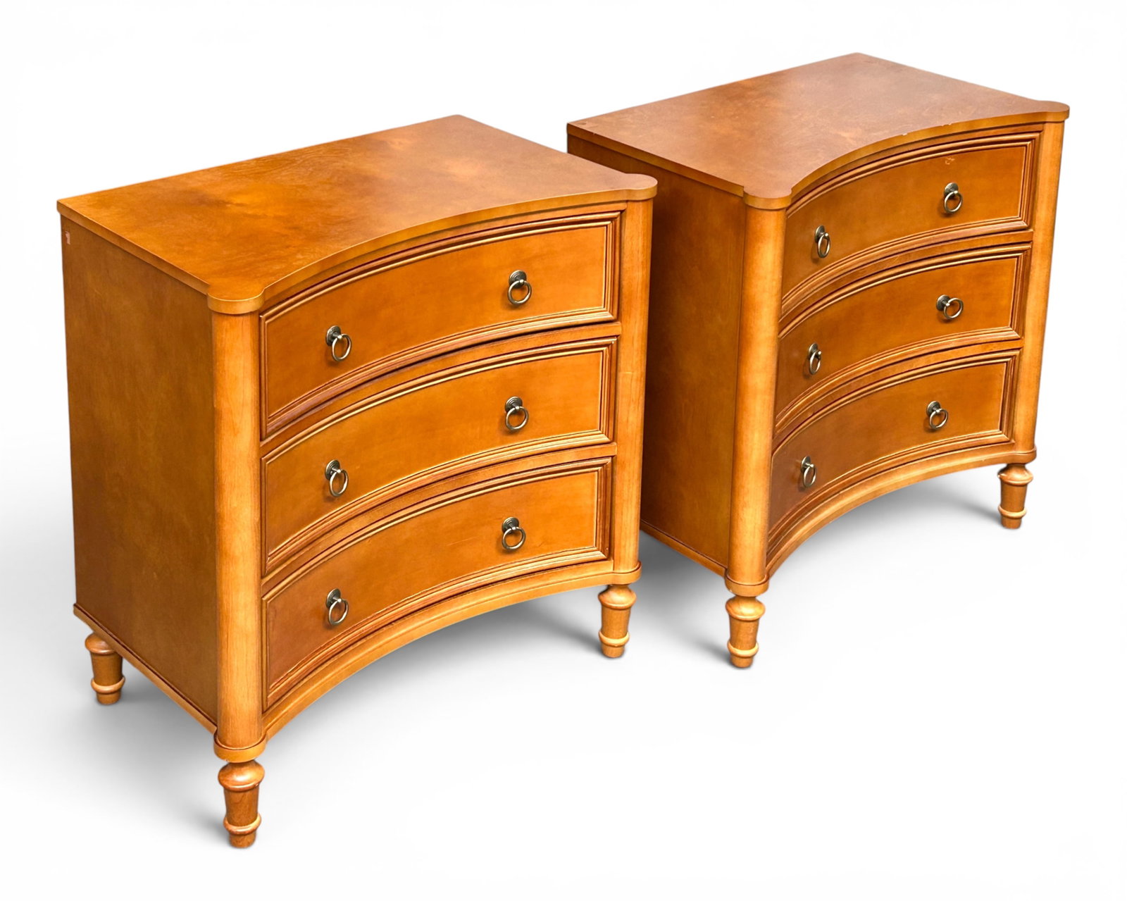 Pair of Contemporary Inverted Bow Front Chests.: The chests each have three drawers with brass hardware and power outlets on the back. They are in good condition, with some minor wear. Each one measures 26" wide, 16" deep, and 27 1/2" tall.