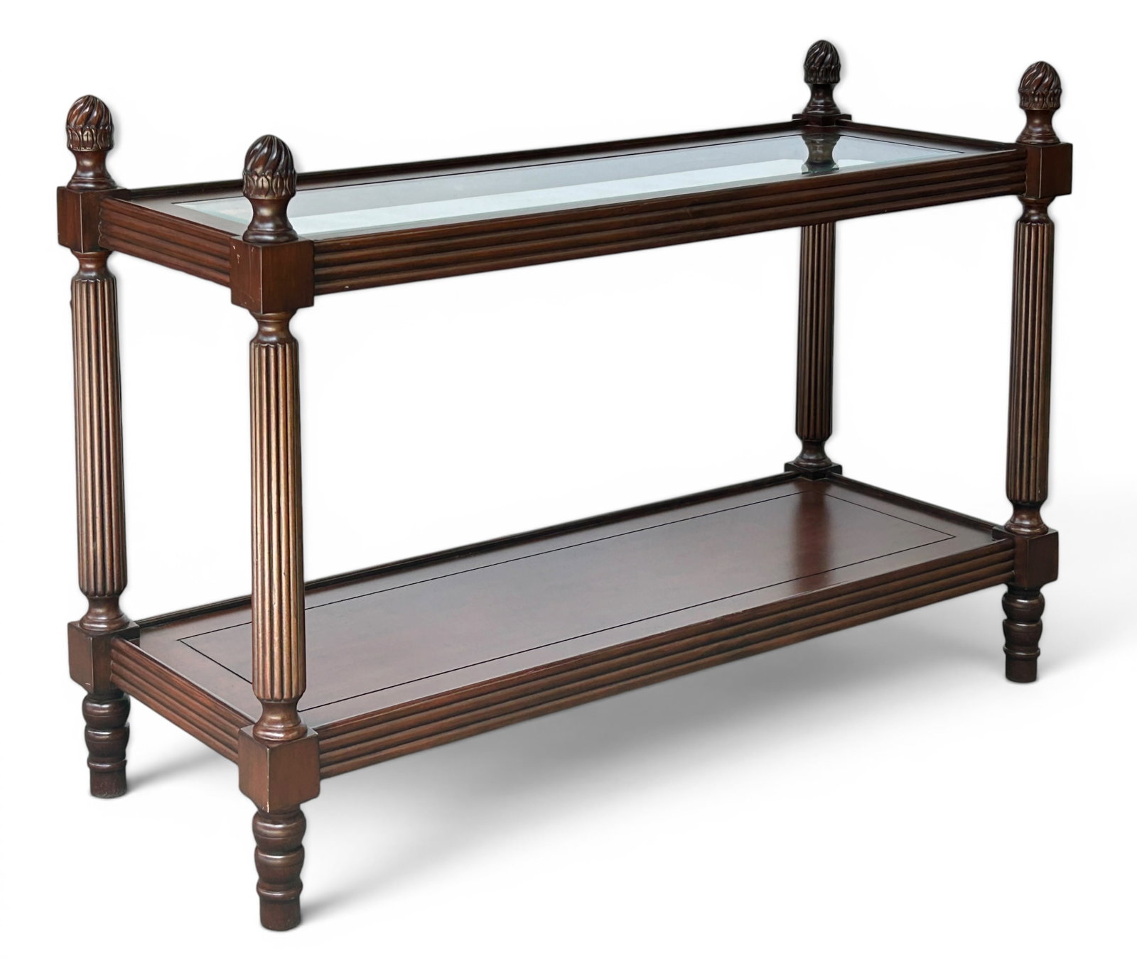 Contemporary Glass Top Console Table.: This console or sofa table is made in China and has a mahogany finish. It has two tiers with flame finials on each corner. The top tier has bevelled glass. There are some chips in the piece, but