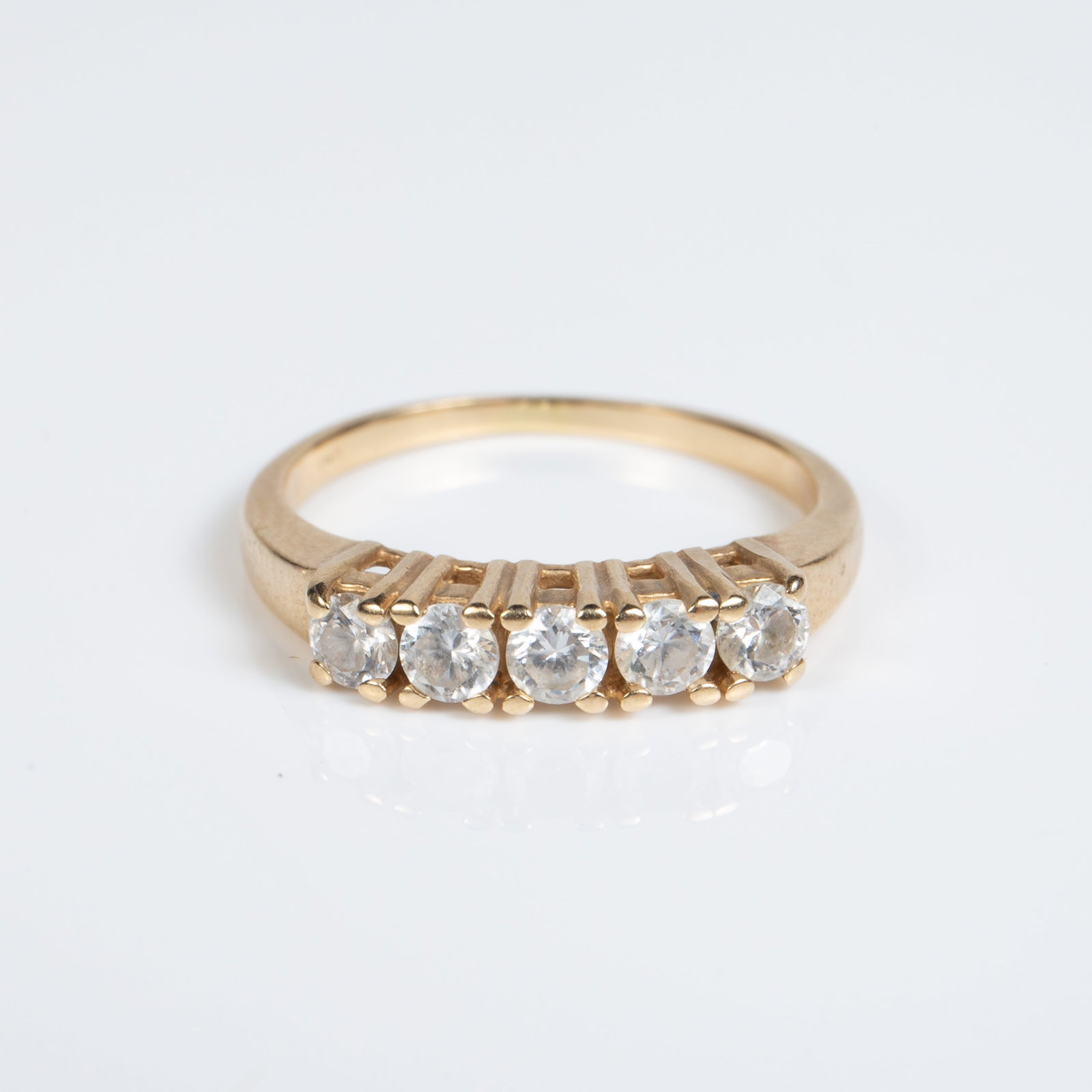14K Yellow Gold & Cubic Zirconia Ring.: The unmarked ring tested appropriately for 14K gold. It features a row of 5 round cubic zirconia stones, which measure 3mm in diameter. The ring is a size 6 1/4, and weighs 1.8 Pennyweight, or 2.8 Gra