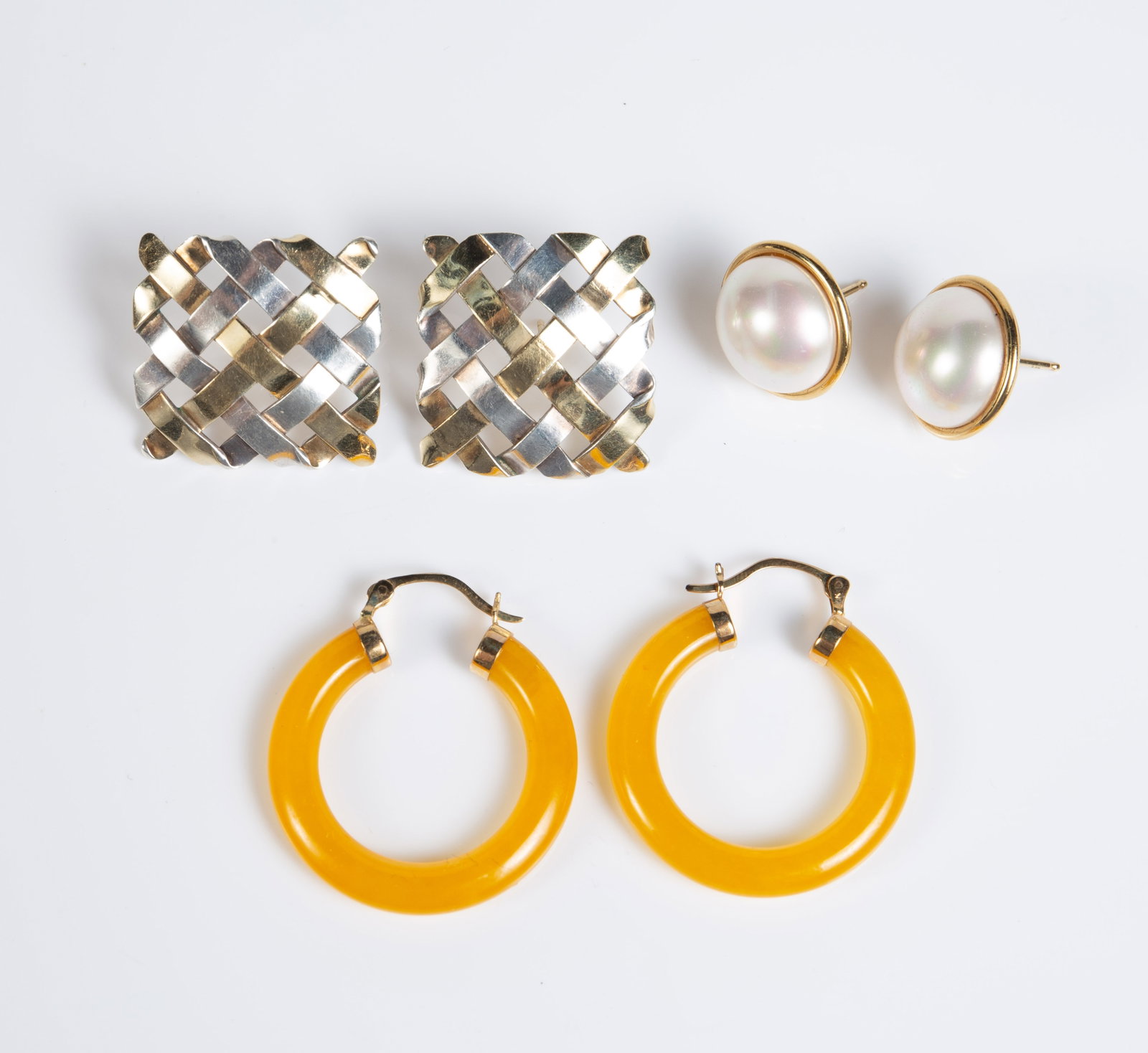 Lot: 3 Pair Earrings - 14K & Ofiesh 18K & Sterling: The lot contains 3 pair of earrings. There is a square woven style pair by Gabriel Ofiesh with 18K gold and sterling silver weaves. They are branded and marked 95% S/S, 5% 18K on the backs. They measu