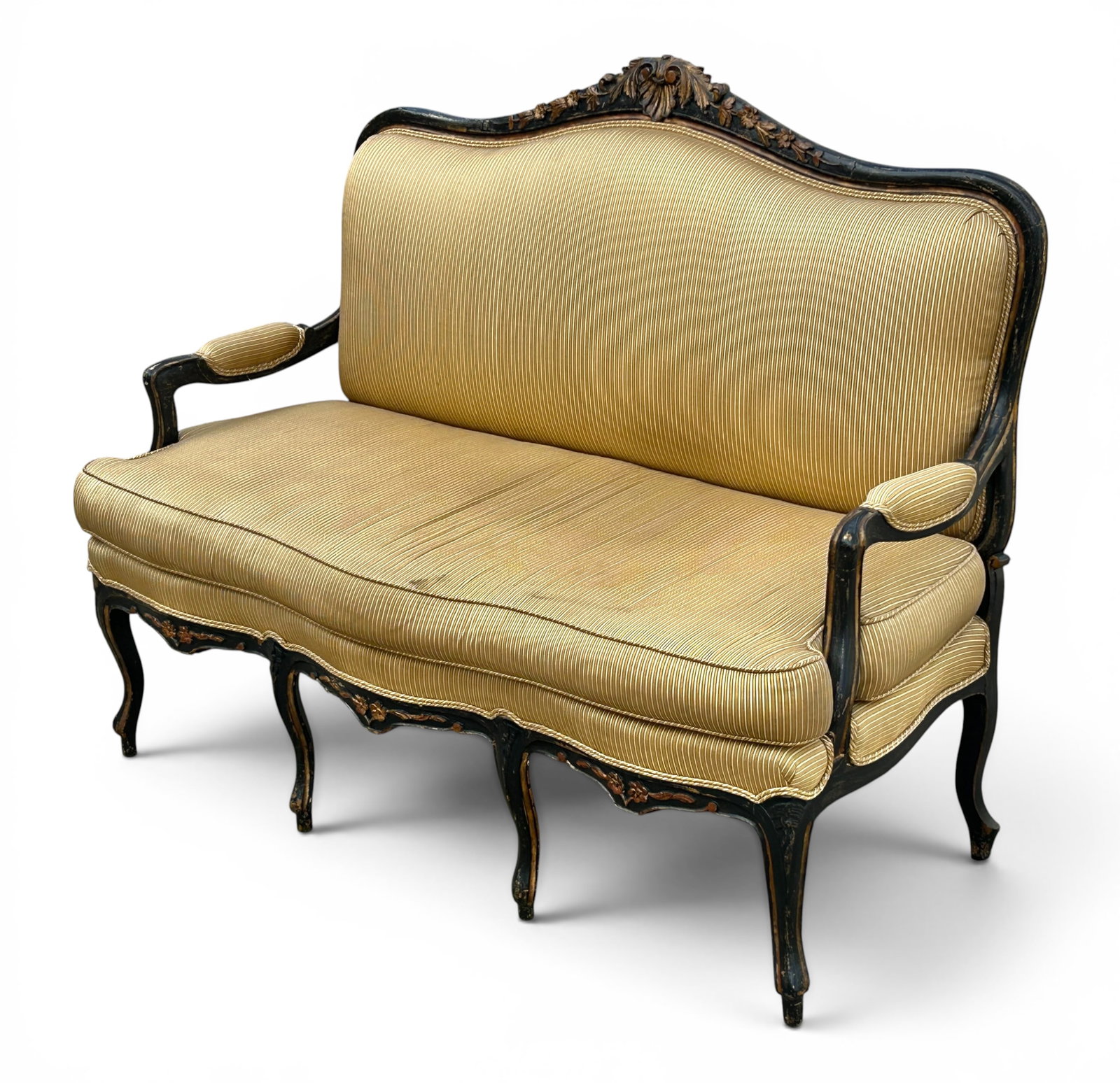 Carved French Louis XV Style Settee.: The settee has an ebonized and giltwood frame, a carved floral crest, padded armrests, and carvings on the apron and legs. There is some paint loss and other minor wear. It measures 55" wide, 22 1/2" 