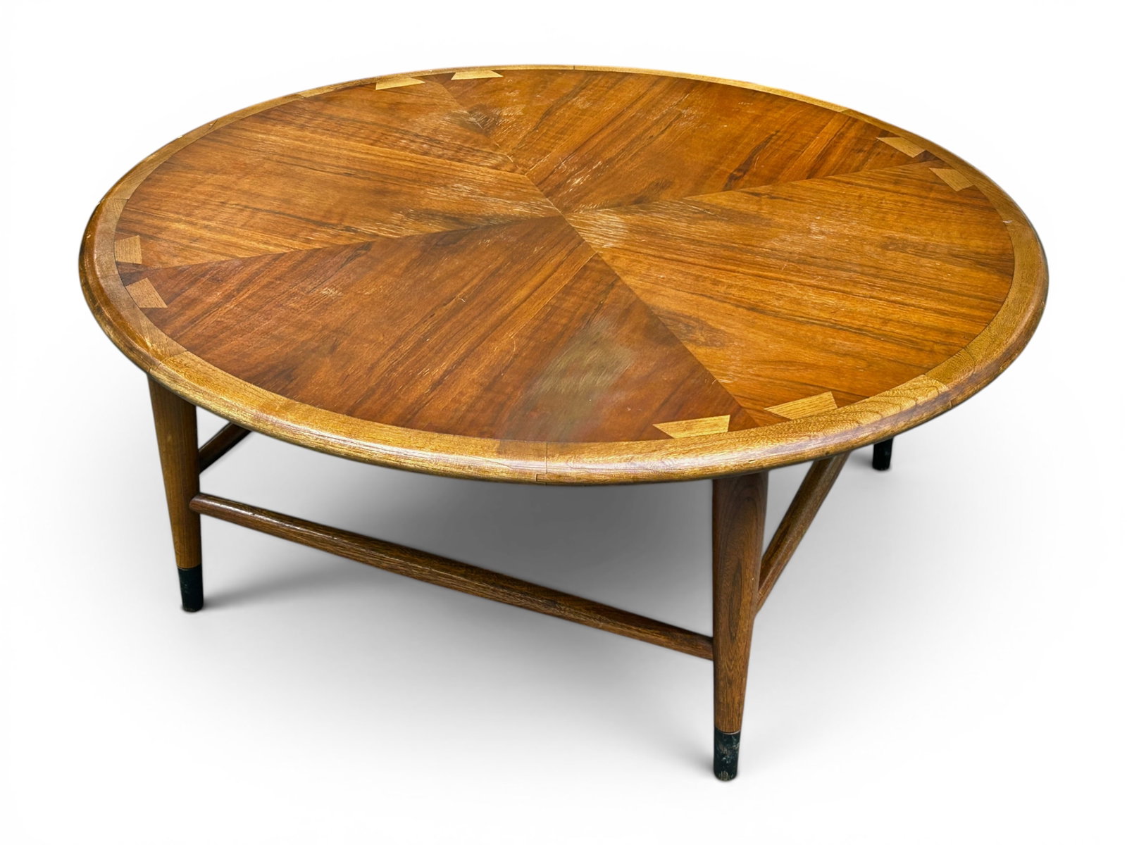 Lane Acclaim Round Coffee Table.: This walnut Mid-Century Modern circular table has a parquetry top, tapered legs, and stretchers. The style number is 900 93. The serial number is 46652. There is some surface wear on the top, but over