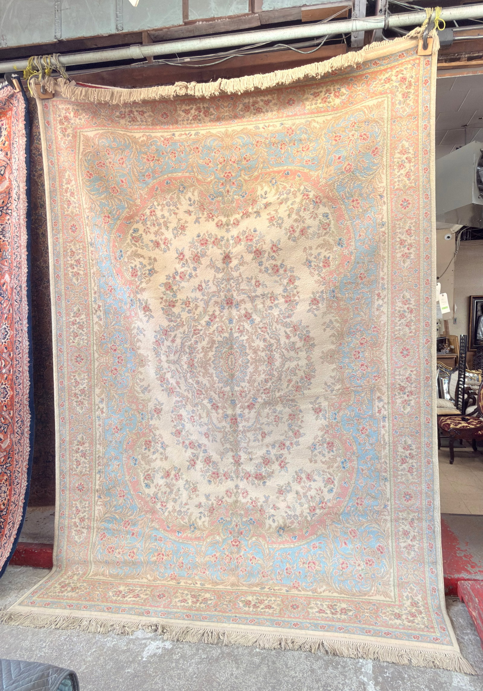 8' 6" x 12' 6" Beige Karastan Rug.: The rug looks to be a Kirman pattern. It looks to be in good overall condition. In-House Shipping is available for this rug. Please see our website for our in-house shipping procedures.