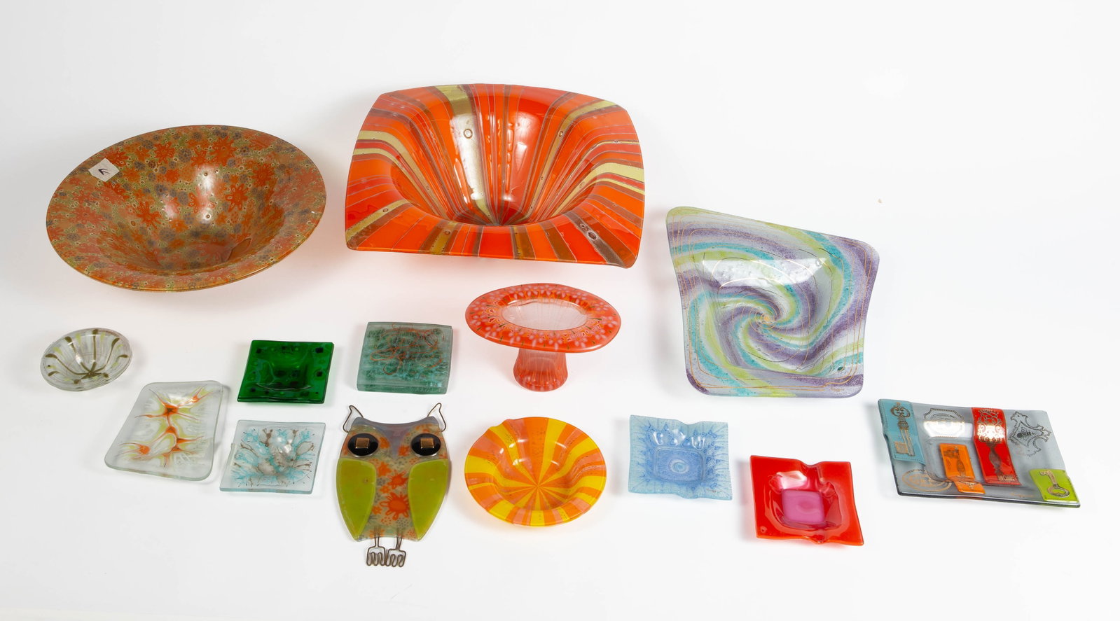 14 Pc. Lot of Higgins Glass- Owl, Ashtrays, Bowls.: The lot looks to be in nice cosmetic condition. A few of the smaller items look to be unsigned. The largest item in the lot measures 13 5/8" x 13 5/8" x 4 1/8". The smallest item measures 3 1/2" x 3