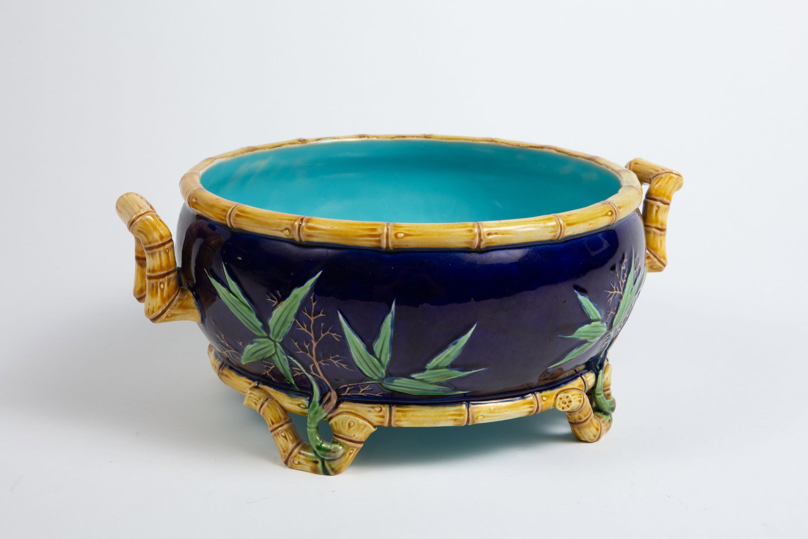 Minton Majolica Asian Stule Jardiniere w/ Bamboo.: It looks to be in nice cosmetic condition, with some crazing. It measures 11 7/8" x 9 1/2" x 5". In-house shipping is available. Please see our website regarding in-house shipping procedures.