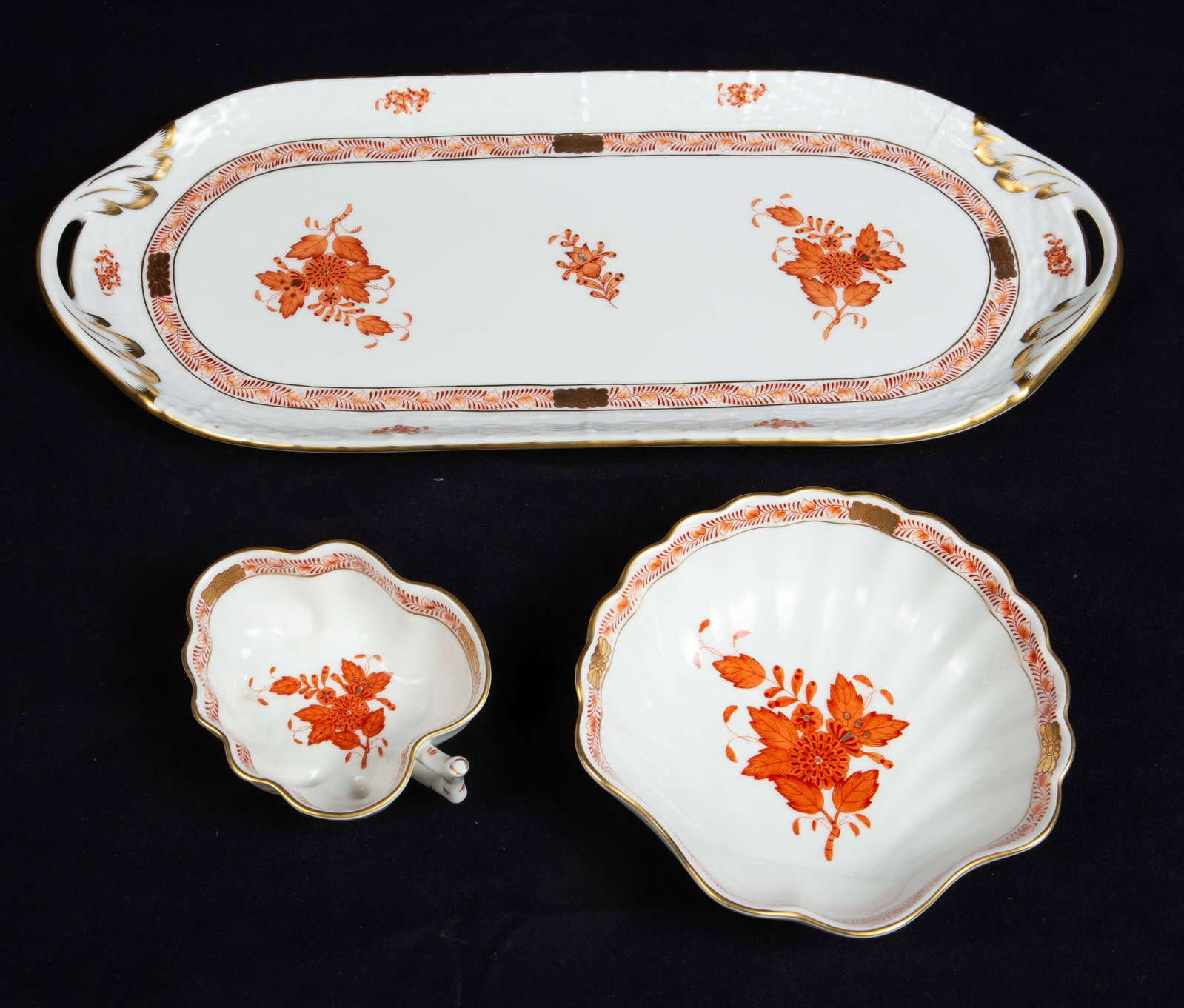 Herend Hungary Bouquet Rust: Chinese Style Dishes.: This set of three includes a sandwich tray, a leaf-shaped trinket dish, and a clamshell-shaped bowl. The lot looks to be in very nice cosmetic condition. The largest item measures 14 3/8" x 6 1/8" x 7