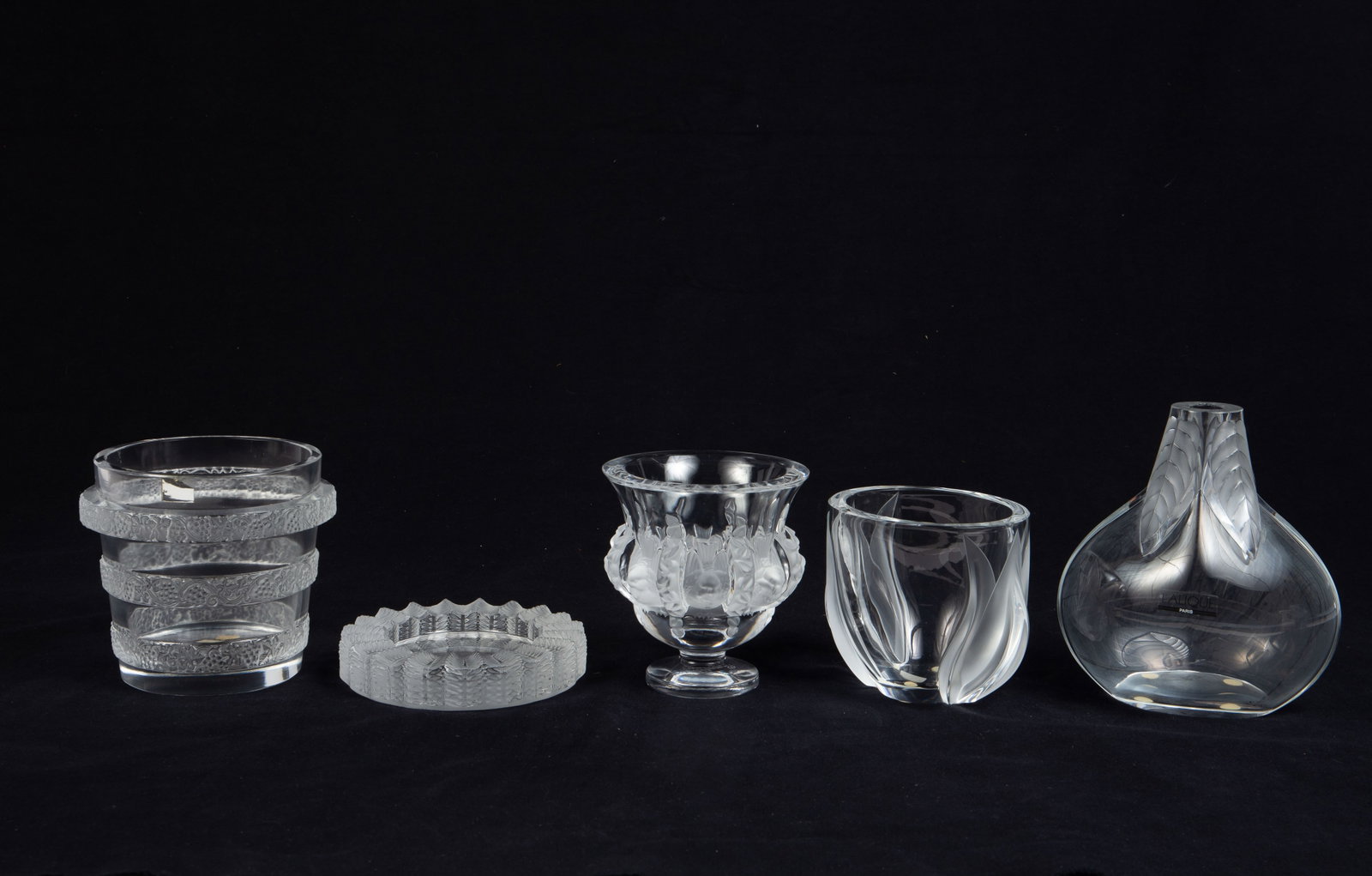 Lot of 5 Lalique Pcs., Mostly Vases.: The lot includes the following: a "Deux Tulipes" vase, a "Riquewihr" ice bucket with grape motif, an "Osumi" leaf vase, a "Dampierre" vase with sparrows, and a "Jamaique" ashtray. The lot looks to be 