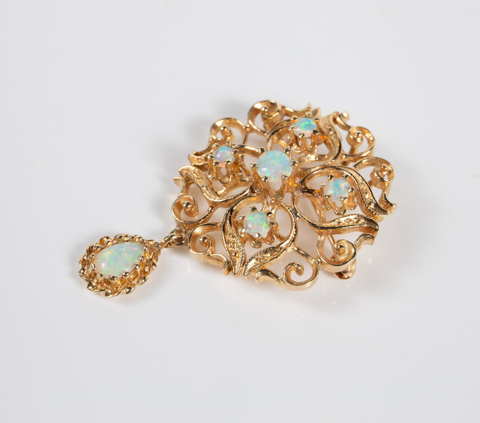 Bimelt Gold & Opal Victorian Revival Brooch.: The brooch appears to be marked Bimelt on the back. It was tested electronically and found to be gold on copper, with a total of 47.9% gold. It has an ornate filigree design with 5 opal cabochon stone