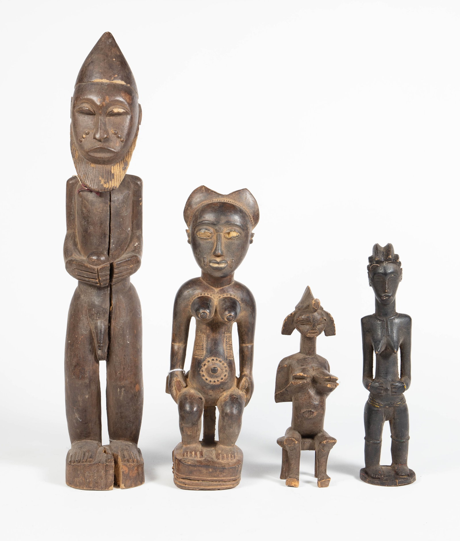 Lot of 4 Carved Wood African Figures. (1 of 6)