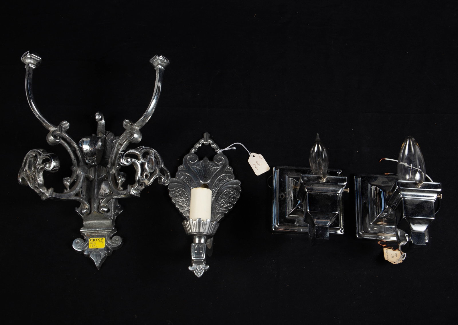 Lot: Vintage Silver-Colored Sconces and Coat Hooks: The two sconces that are a matching pair are missing their shades. The third sconce is lightweight, and is meant for a candle-style light bulb. The coat rack can hold up to four coats. It is the large