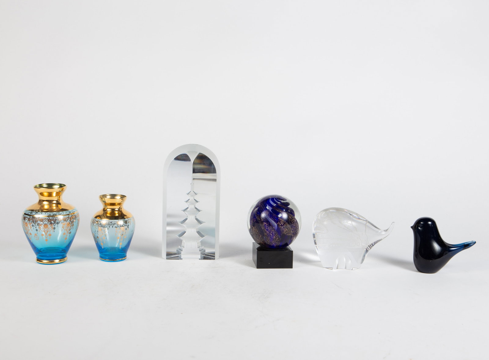 Lot: 6 Pcs. of Art Glass- Paperweights & Vases.: The elephant paperweight has a chipped trunk, and the bird has a chipped beak as well. The other pieces look to be in good condition. The largest item is the Hoya crystal pagoda paperweight (small