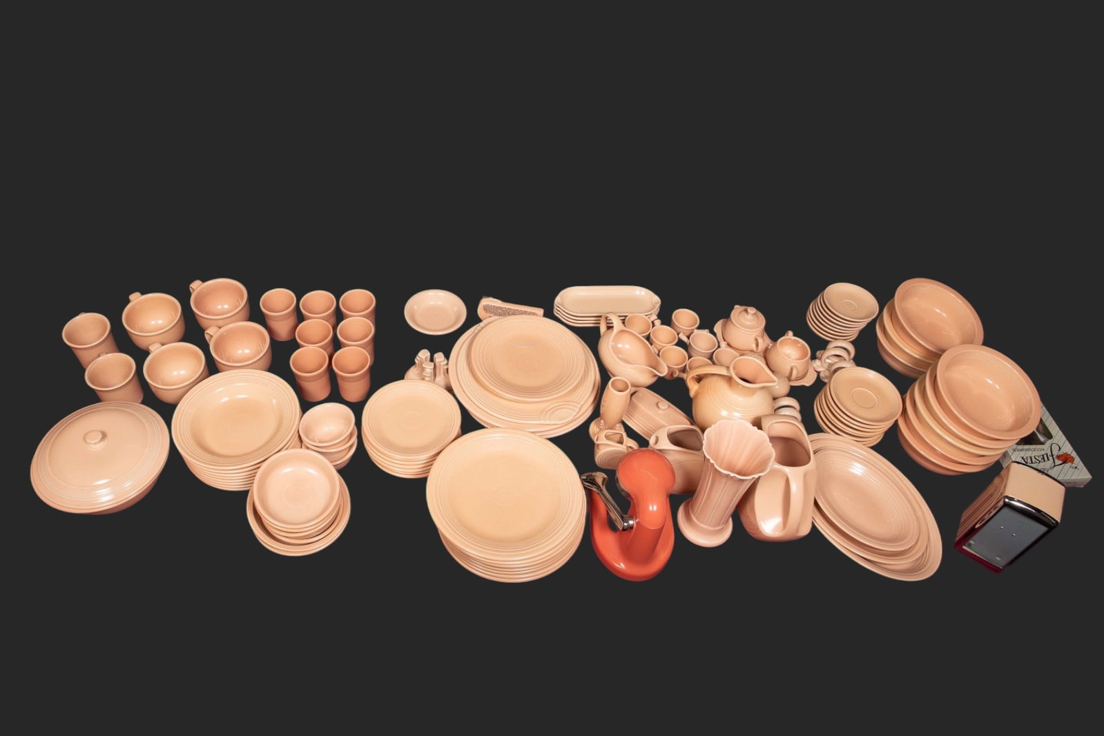 Large Set of Homer Laughlin Fiesta Ware Dishes.: There are over 120 fiestaware pieces, mostly in the apricot color (the citrus juicer is in another color). Included are dinner plates, soup plates, salad or pasta bowls, soup mugs, demitasse cups,