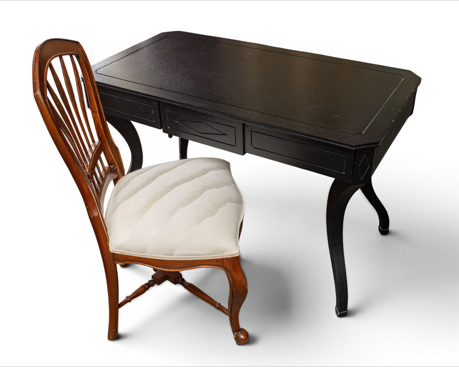 Ebonized Desk & Carved Chair.: The French style desk has three drawers, diamond pattern carvings, a carved apron, and cabriole legs. The chair has a walnut frame, feather backsplat, upholstered seat, and carved details. There is so