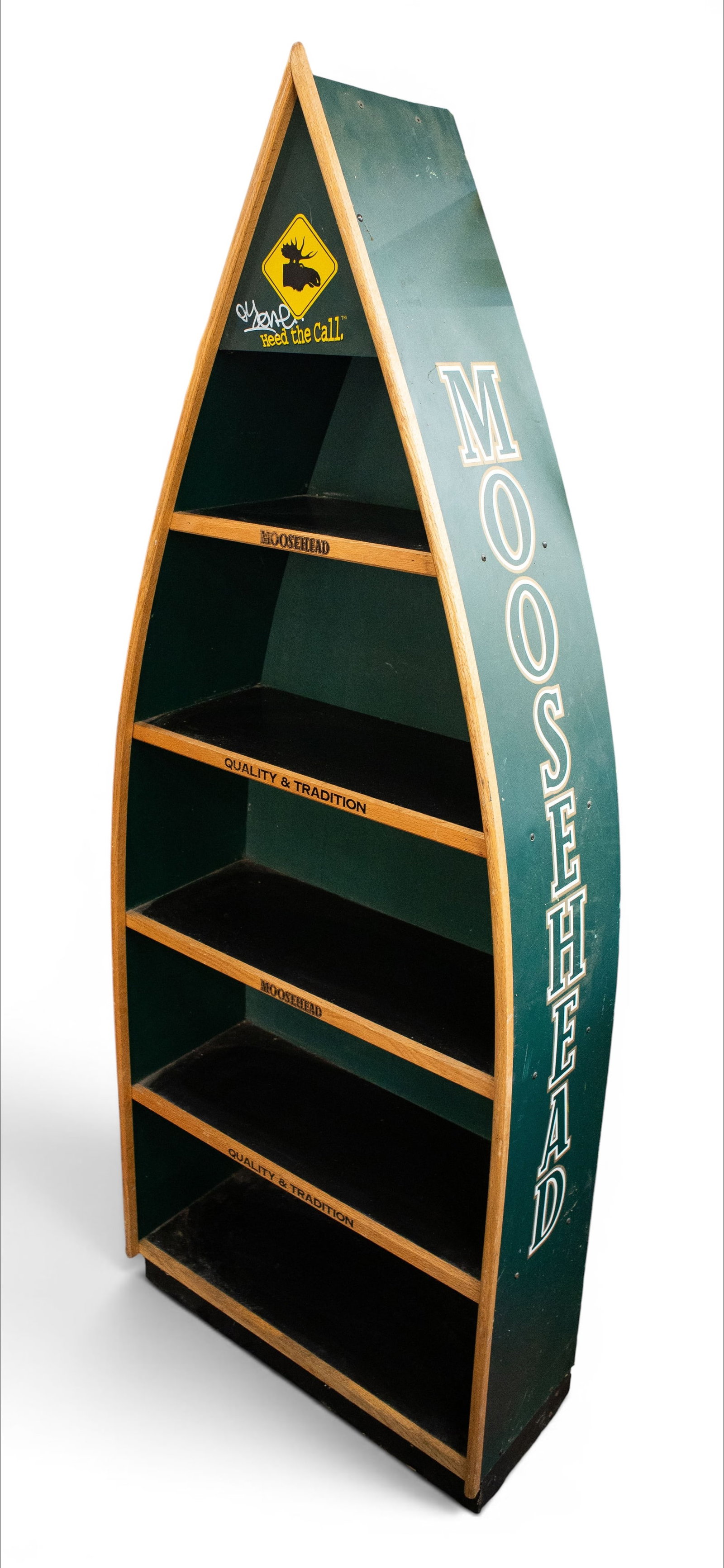 Canoe Bookshelf - Moosehead Beer Advertising.: This vintage promotional canoe-shaped bookshelf has four fixed shelves. The front has an oak trim. There are some scratches, but overall it is in good condition. It measures 28" wide, 12" deep, and 77