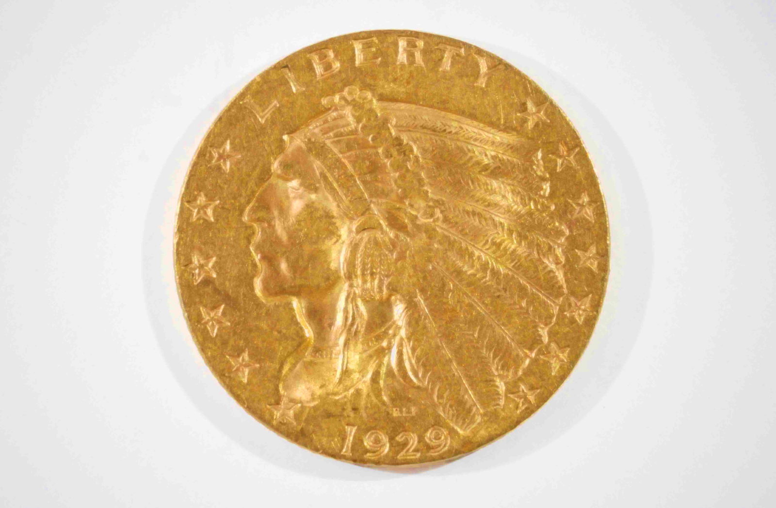 1929 $2 1/2 Indian Head Gold Coin.: The coin is lightly circulated. It weighs 4.18 grams, is 90% pure, and contains .121 oz. of actual pure gold weight. In-house shipping is available. Please see our website regarding in-house shipping 